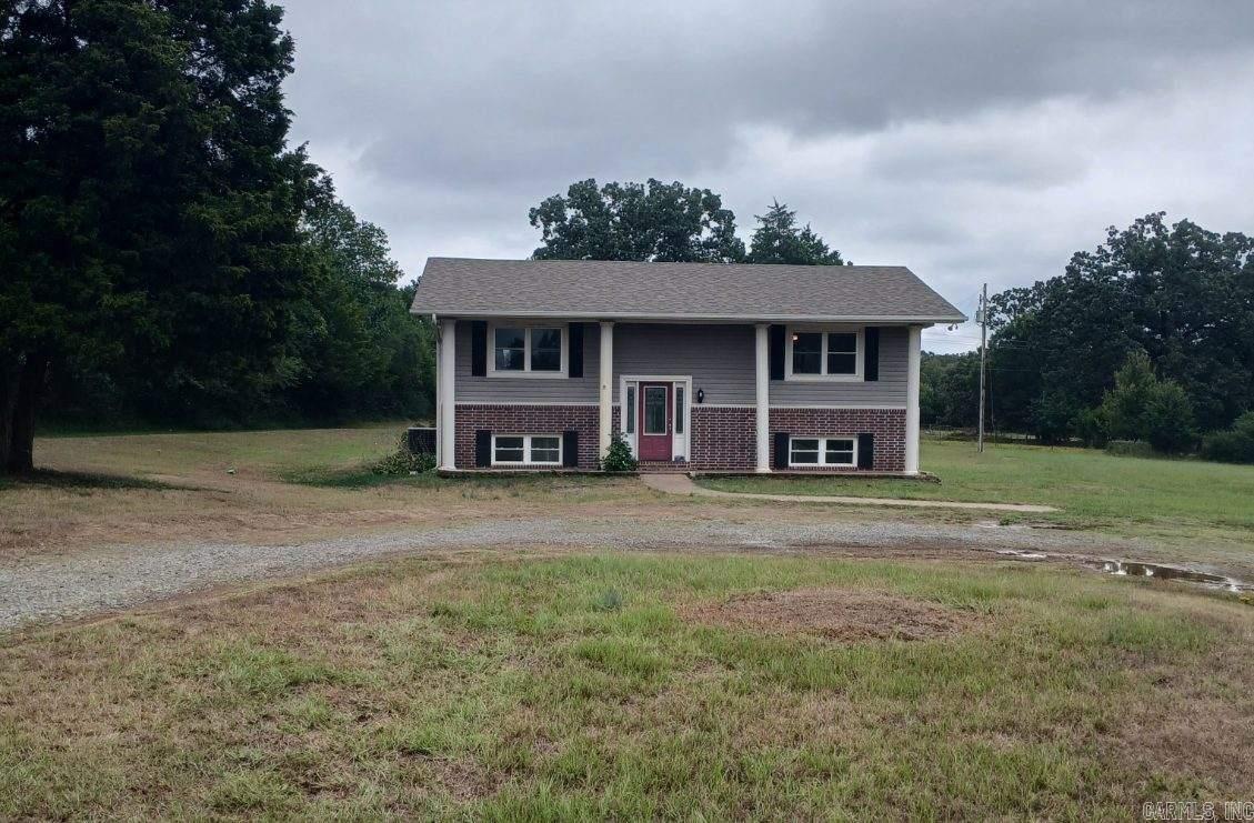 This nice country home is ready for you to make it your own! The main level welcomes you with a split entry leading you up to a partially open floor plan, breakfast bar, sliding door to the large, covered deck, and the primary bedroom and bathroom! The lower level has three additional bedrooms, one of which could make an excellent bonus room/game room/second living room. With just over 10 acres featuring a mix of cleared and wooded land, you can have your livestock and privacy at the same time.