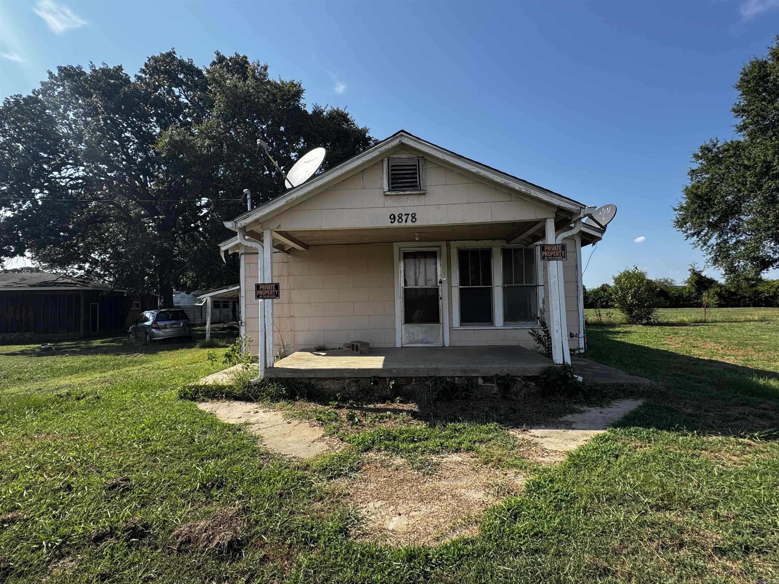 Two homes sit on this acre lot with a mountain view, conveniently located off of highway 64. With some TLC they would make a great primary and secondary residence or even as rentals. The first home is a 2 bed, 1 bath, 1113 sq ft with a fenced back yard and animal pen, with a storage building and a view of pastures and hills in the back. It also has a carport with attached storage room and a step down laundry room. The second home is a 2 bed/ 1 bath, 792 sq ft home with an in ground tornado shelter that could make an excellent mother-in laws quarters, secondary home, or rental.