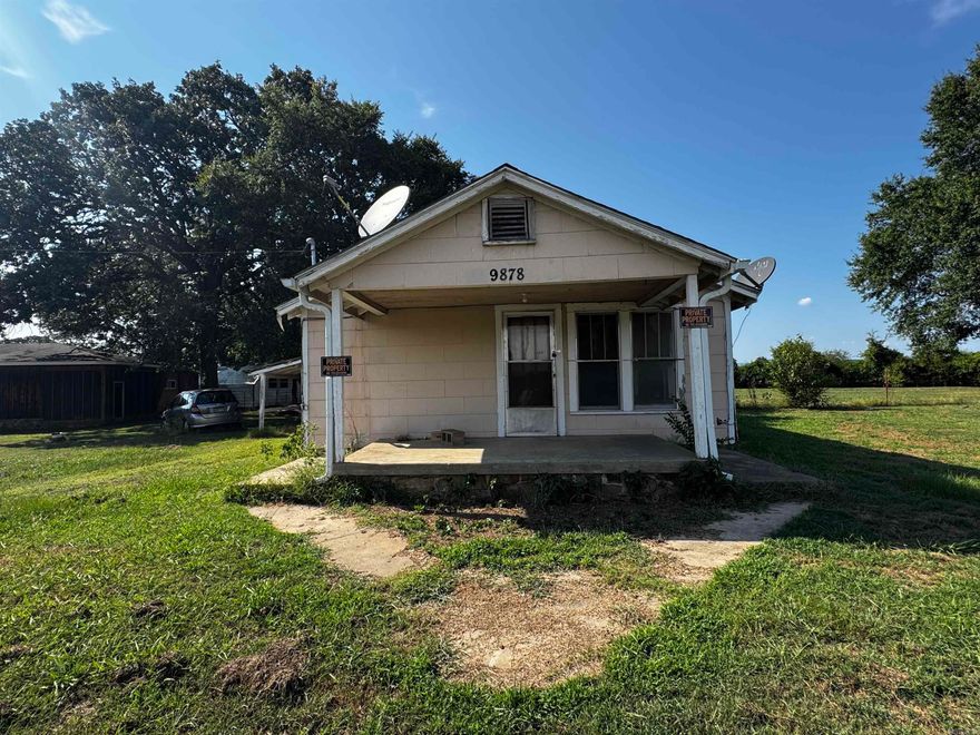 Two homes sit on this acre lot with a mountain view, conveniently located off of highway 64. With some TLC they would make a great primary and secondary residence or even as rentals. The first home is a 2 bed, 1 bath, 1113 sq ft with a fenced  back yard and animal pen, with a storage building and a view of pastures and hills in the back. It also has a carport with attached storage room and a step down laundry room. The second home is a 2 bed/ 1 bath, 792 sq ft home with an in ground tornado shelter that could make an excellent mother-in laws quarters, secondary home, or rental.