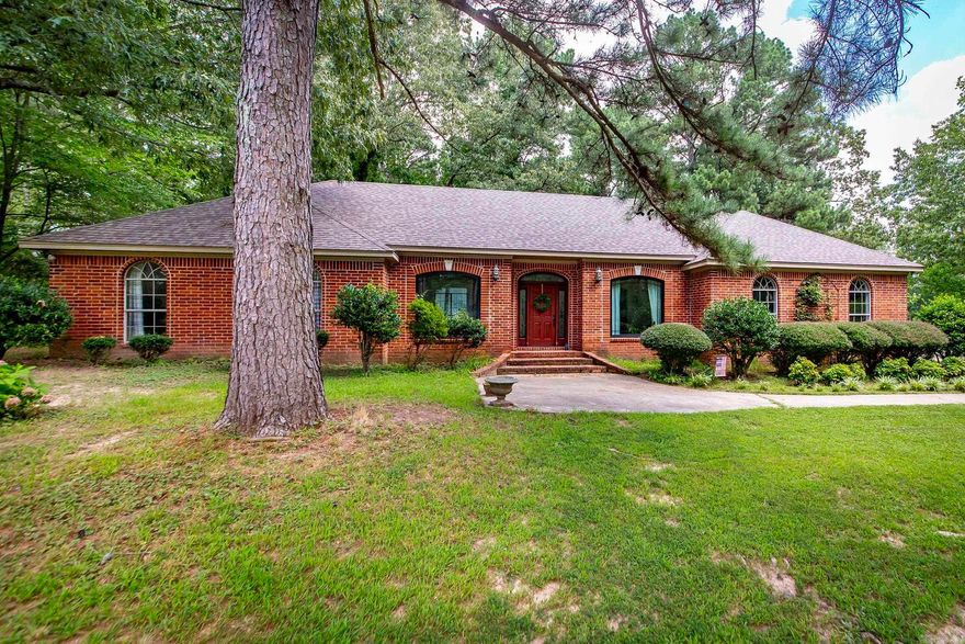 Seller will pay $3,000 towards buyer's closing costs! What a beauty! As you drive to this home, you will feel the tranquility of peace through the huge trees cascading the roadway-so serene!  Brick home with 3 stall barn for horses. Home has been remodeled in 2018 with new roof, new flooring, new appliances and new kitchen! Fireplace with new gas logs also. You will love the soft blue painted cabinets and the white quartz countertops and yes, for the cook of the family... two sinks!!!! Enjoy the open friendly living area for family gatherings! Brand new Anderson windows in living and dining area and two bedrooms welcoming the taste of nature and beauty into your home.  Separate office for those working from home. RV hookups also on the property for power and sewer. See agent notes