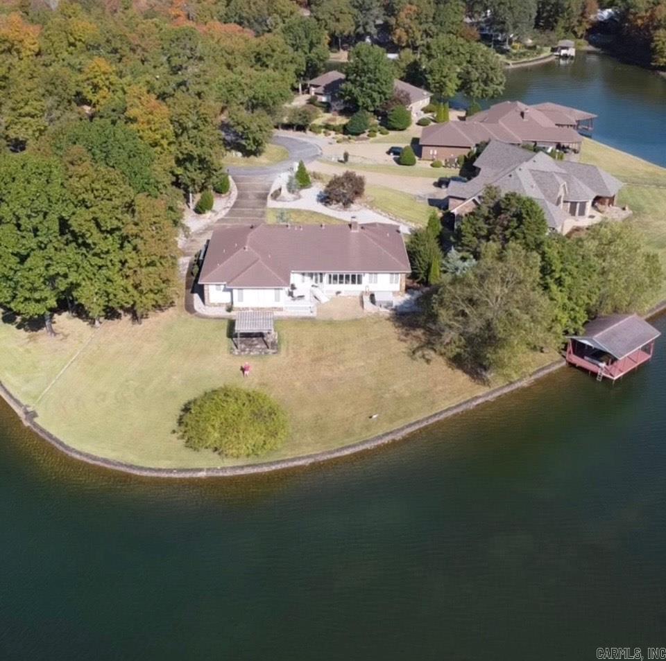 "WATERFRONT", This PREMIUM, LEVEL lot is a RARE find with a full LAKE VIEW OF LAKE BALBOA! One level home on flat lot located in a cul-de-sac on a point that offers a beautiful sunroom to enjoy the views as well as deck with stone patio. Chef's kitchen that includes double ovens and refrigerator that conveys and perfect for entertaining. Open the pocket door to a formal dining room with tray ceiling or transform into a game room or guest bedroom. This lake home has 4 bedrooms, 3 baths, beautiful STONE FIREPLACE, with a very private master suite with beautiful views to wake up to. So many features with this one including boat dock with lift and swim platform, 253' on lake with stone seawall, hot tub, custom rock waterfall, pergola with stone sitting area, lake fed sprinkler system, extensive landscaping and much more. Call for all extras! Don't miss seeing this one.