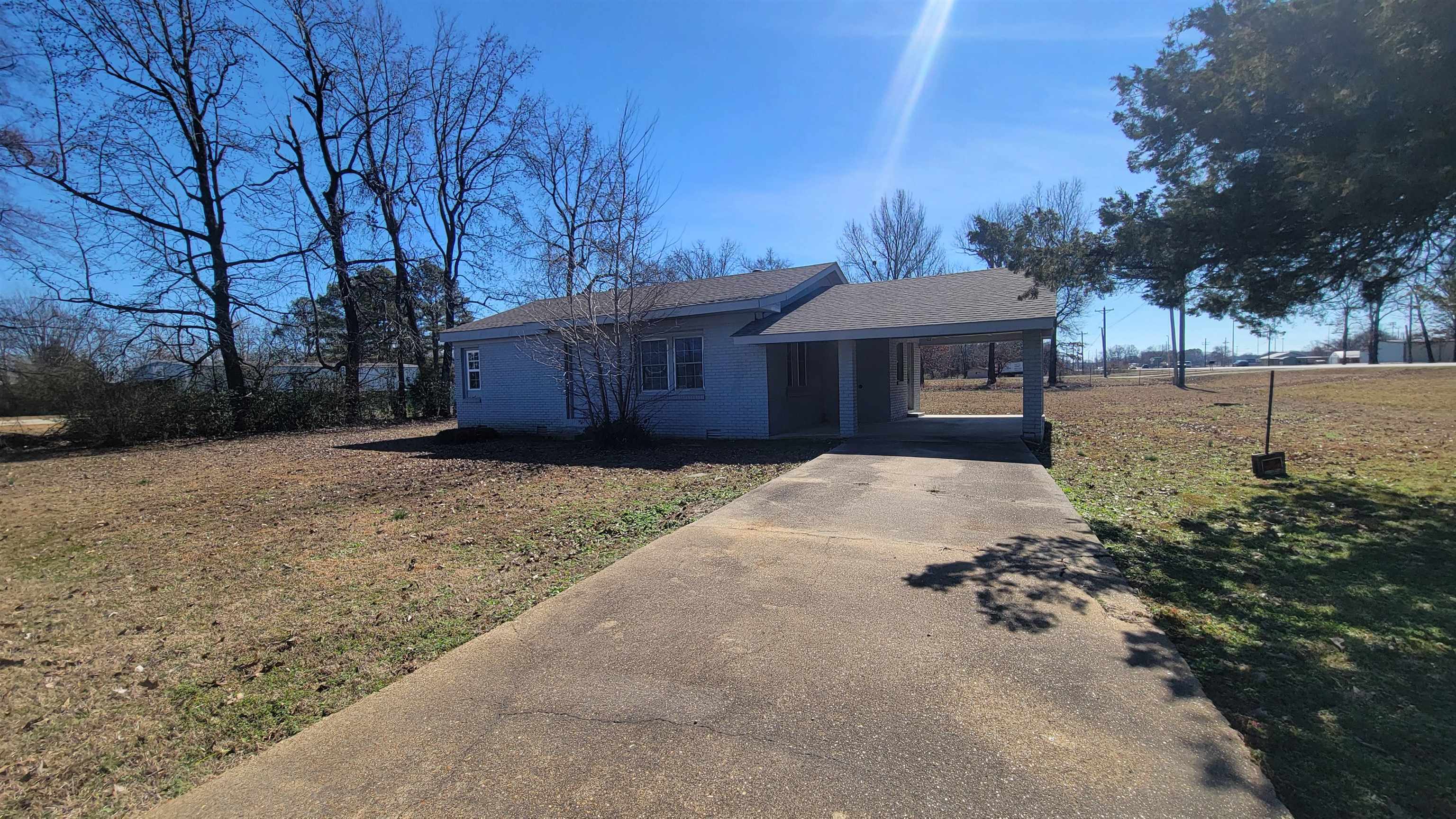 Located at the corner of Stadium Blvd and Colony Drive, 0.96-acre lot with a single-family home. Home is 966 square feet and includes new roof. Interior of home is unfinished. Property is zoned C-3 and has city utilities.