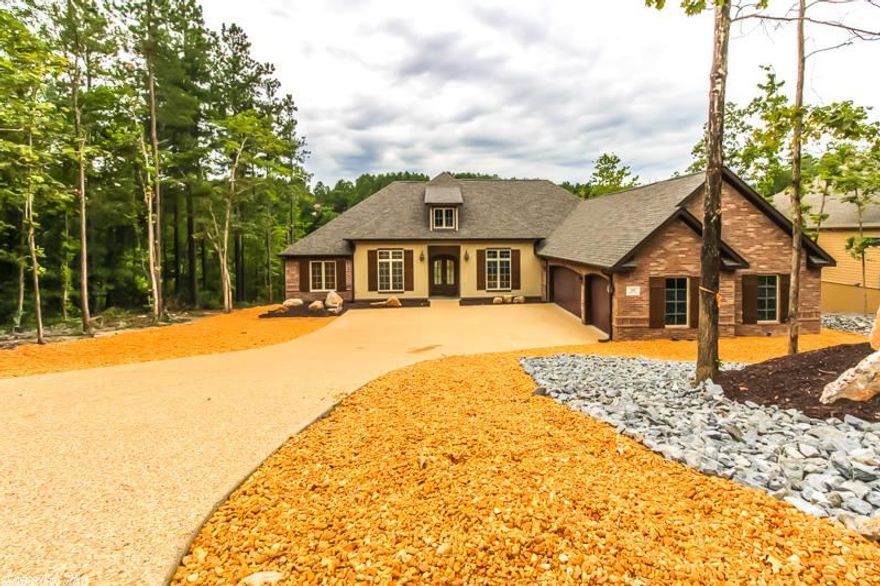 This is the Carriage Chateau expanded plan.  This Country French house feature a wide open floor plan.  Chef's kitchen with huge island, stainless steel appliance double ovens, and  custom built cabinets.  The Master bath has a Roman shower and huge master closet. Take in the gorgeous view with your huge covered deck.  This house was made for entertaining or for quiet evenings watching the sunset. Need a big "MAN CAVE" or Grandchildren "Haven."  Check out the bonus area on this one!! Taxes are on lot only.