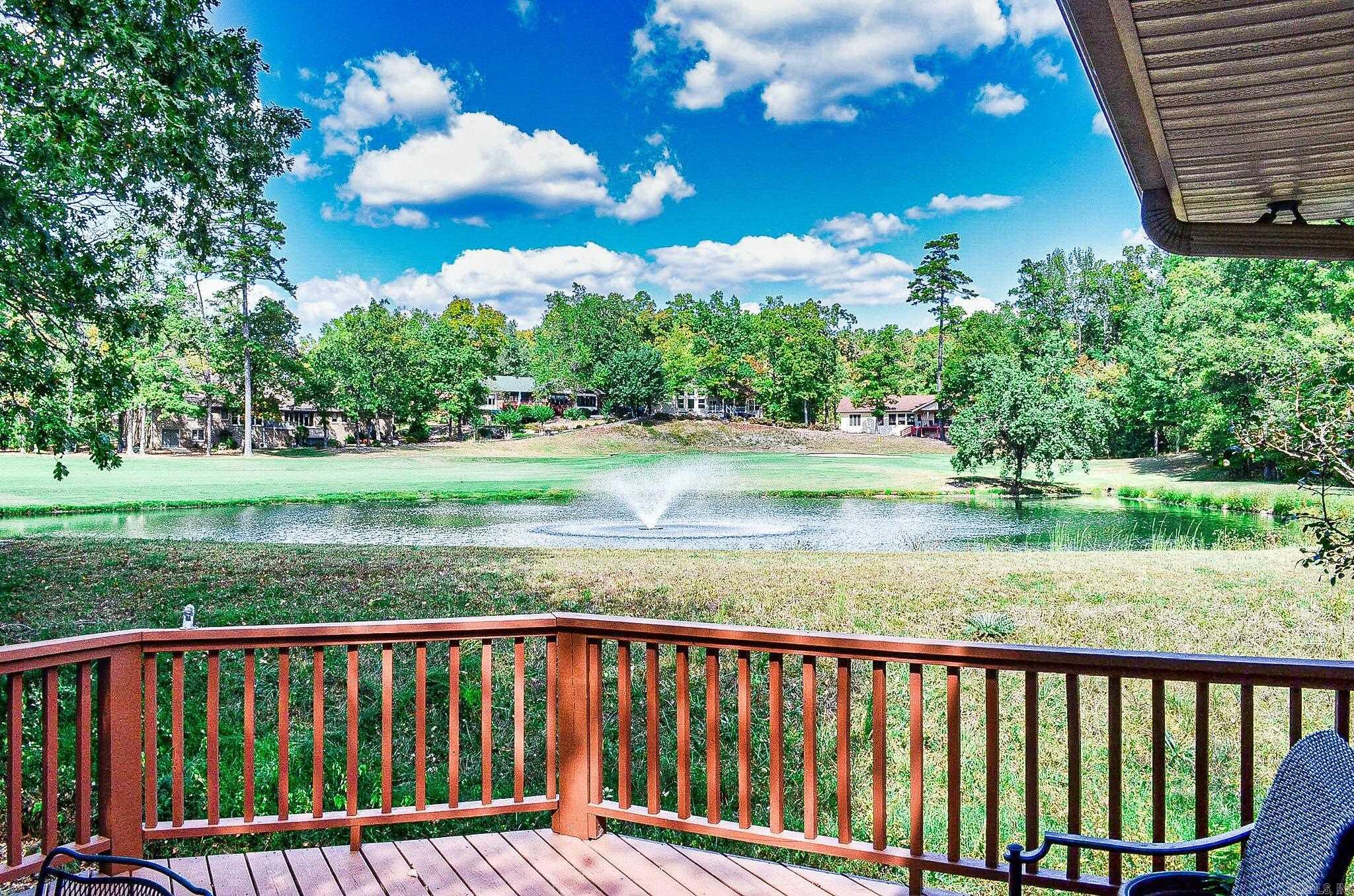 AGENTS SEE REMARKS! This is it!! On the 4th Green of the "Hill Course" Cortez Championship in Hot Springs Village!! Surrounded by water with a beautiful fountain. Sit in the all windows Arkansas Room and enjoy the view or outside on the deck. One level,split bedrooms, open floor plan, and no wasted space. Primary bedroom has privacy on one whole end of the house with private office, bedroom, bath with double vanity, shower, jetted tub and walk-in closet. Oversized two-car garage with lots of storage. Low maintenance landscaping on a low traffic cul-de-sac should check every box!! ROOF 2020 AT THIS PRICE IT WON'T LAST LONG!!