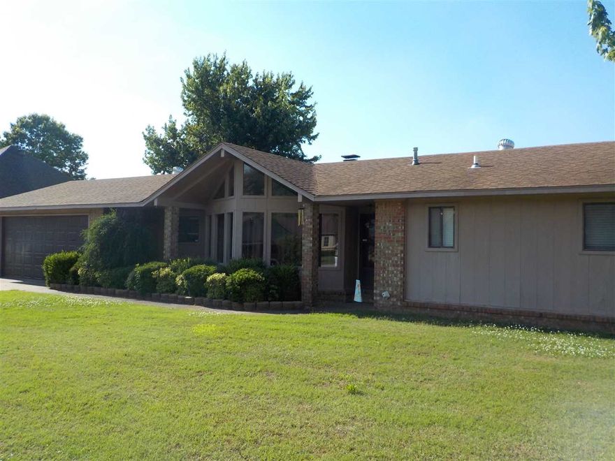Great 3 bed/2 bath home with awesome valet living area with fireplace an a separate dining room.  Lots of cabinets in eat-in kitchen with all appliances including the refrigerator staying.  Nice large laundry room and spacious 2 car garage.  There is a 20X30 Workshop/Storage Building with electricity and overhead door inside the chain link fence.  Great storage for boats, trailers, etc.  Great landscaping accenting the awesome A-Frame windows in front and the nice deck in the back.