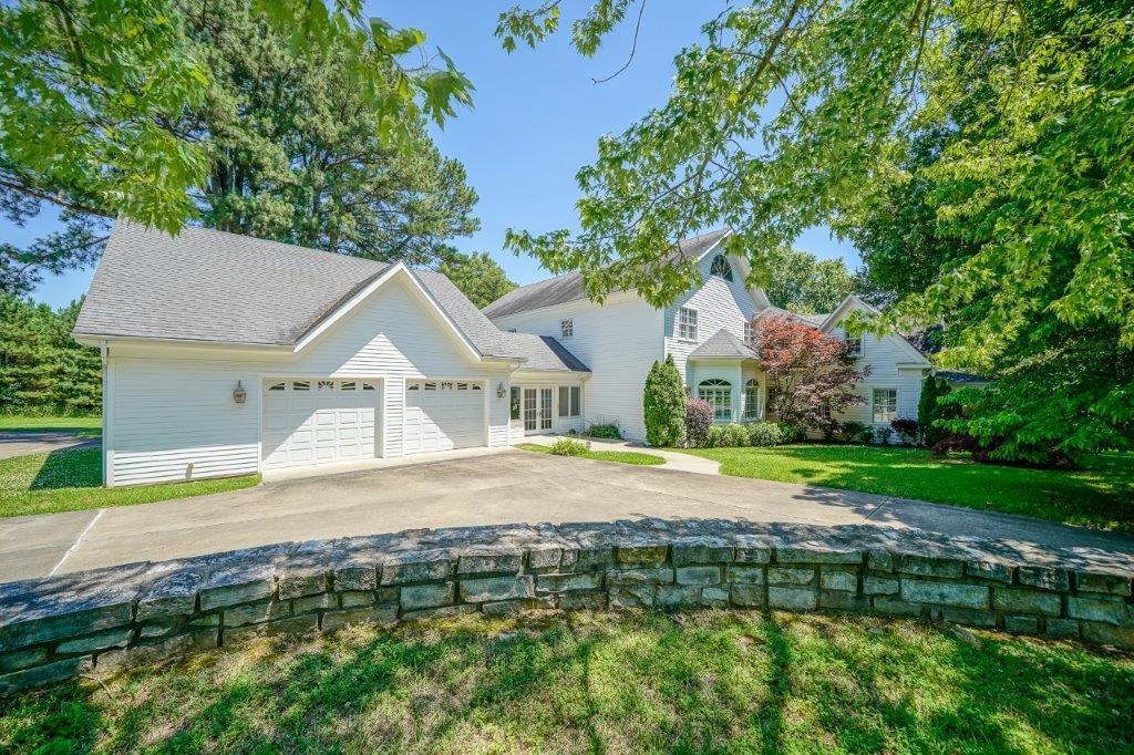 This remarkable home offers the perfect blend of historic charm and modern luxury! This one-of-a-kind home offers 6 bedrooms, 6 full bathrooms, and 2 half baths, designed with spacious living and elegant details throughout. The living room features a beautiful fireplace with vaulted ceilings! The kitchen features custom cabinetry, walk-in pantry, breakfast bar, granite countertops, high-end appliances, completed with an attached dining area. The master suite offers an oversize bedroom with a sitting area, attached full bathroom with a walk in tile shower, jetted jub, & large walk in closet. Upstairs, the bedrooms feature private suites complete with a living room area and wet bar for added comfort and convenience. Additional Features include a sunroom, exercise room, laundry room, formal dining area, library, office, safe room, security system, covered back porch, open patio area, well manicured yard, extra landscaping, a two-car garage plus plenty of bonus features to fit your lifestyle! This home truly has it all! Recent upgrades include a NEW ROOF, walk in tile showers, & more!