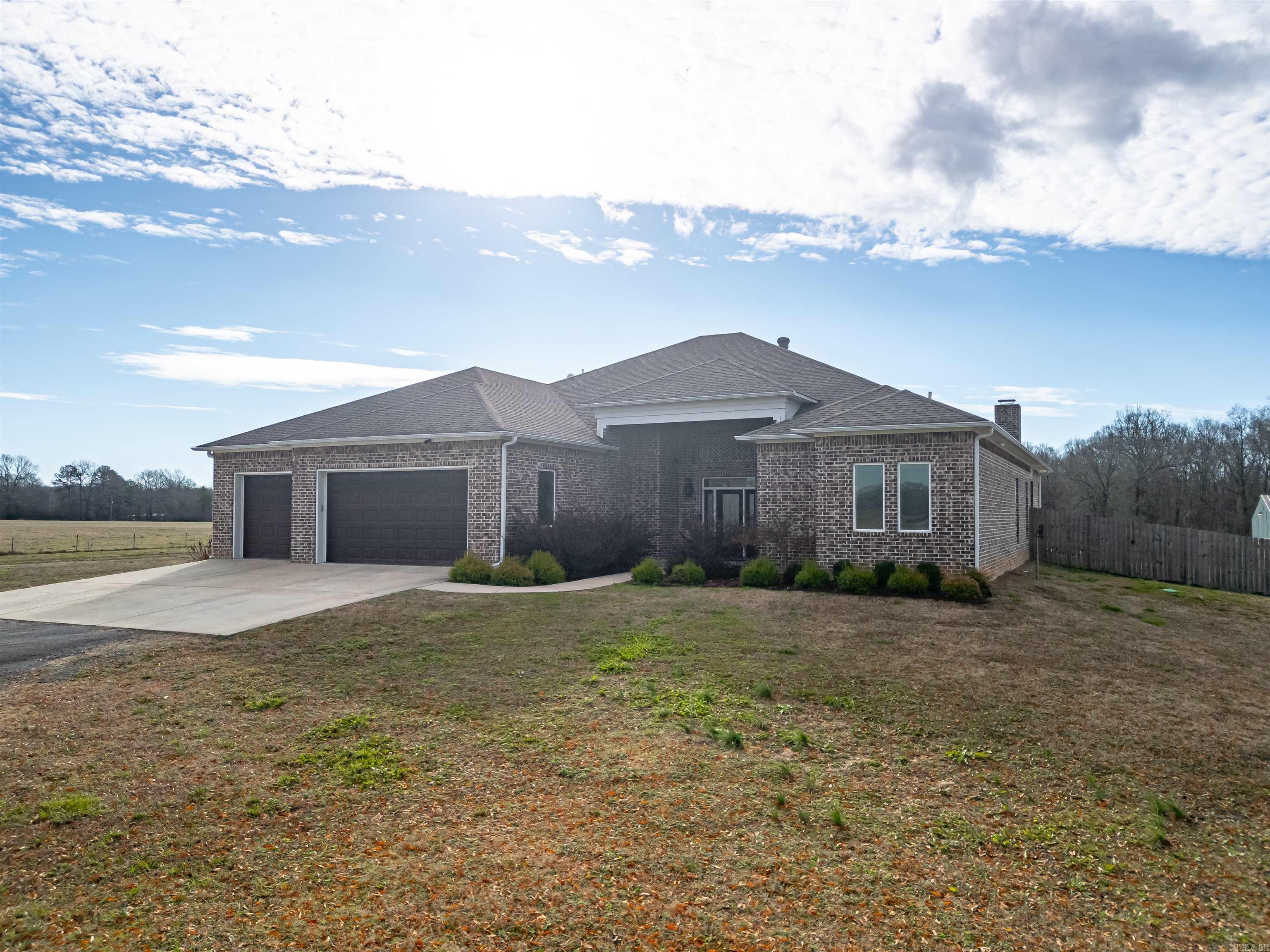 You can stop looking. This property has EVERYTHING. 4bedroom, 2 and 1/2 bath. Built in cabinets in the guest rooms. Open concept living room / kitchen with a massive island. Living room has full wall of built in cabinets. Gas fireplace. Large windows everywhere that flood the house with natural light. 15ft ceiling in the living room. Primary bedroom is large enough to have its own separate living room. 2 walk in closets. Spa like bathroom complete with soaking tub and custom shower. Covered back patio that overlooks the sports pool. Great for entertaining. The 60x40 shop includes 828sqft of heated and cooled living space. Complete with kitchen, bathroom, and laundry room. Soooo many details..... 3 car garage 23'8" deep, exterior 8 camera security system, tankless water heater, all doorways are wheelchair accessible, 2x6 exterior walls with spray insulation, 3zone HVAC system, All Pella windows and doors, LED lighting throughout, Hickory wood floors, Double ovens, Quartz countertops throughout, Outdoor kitchen with gas hookups, Pool, Shop with living quarters, and the fully stocked pond. (catfish and bream) You'll want to see this property.