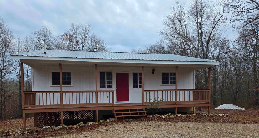 Nestled on nearly ten acres of serene, private land, this unique home is a hunter’s paradise and a retreat for those seeking tranquility. Beautifully updated, the layout features a large primary bedroom with an en-suite bathroom and a versatile bonus room that's perfect as a walk-in closet, office, game room, or anything else you envision. The living room has a wood burning stove, The two-level design of this home offers flexibility and comfort. Upstairs, you’ll find two bedrooms and two bathrooms, while the lower level boasts a third bedroom, a full bathroom, and an additional living space, complete with a room that could easily be used as a full second kitchen - and there's a sink already in place! The property’s outdoor features are just as inviting, with a circle driveway and ample parking, a storage shed, a back deck overlooking the lush wooded surroundings, and a charming front porch ideal for morning coffee and watching the deer and other wildlife. The house has a metal roof. Whether you’re looking for a private getaway or a versatile home to suit your lifestyle, this property has it all.