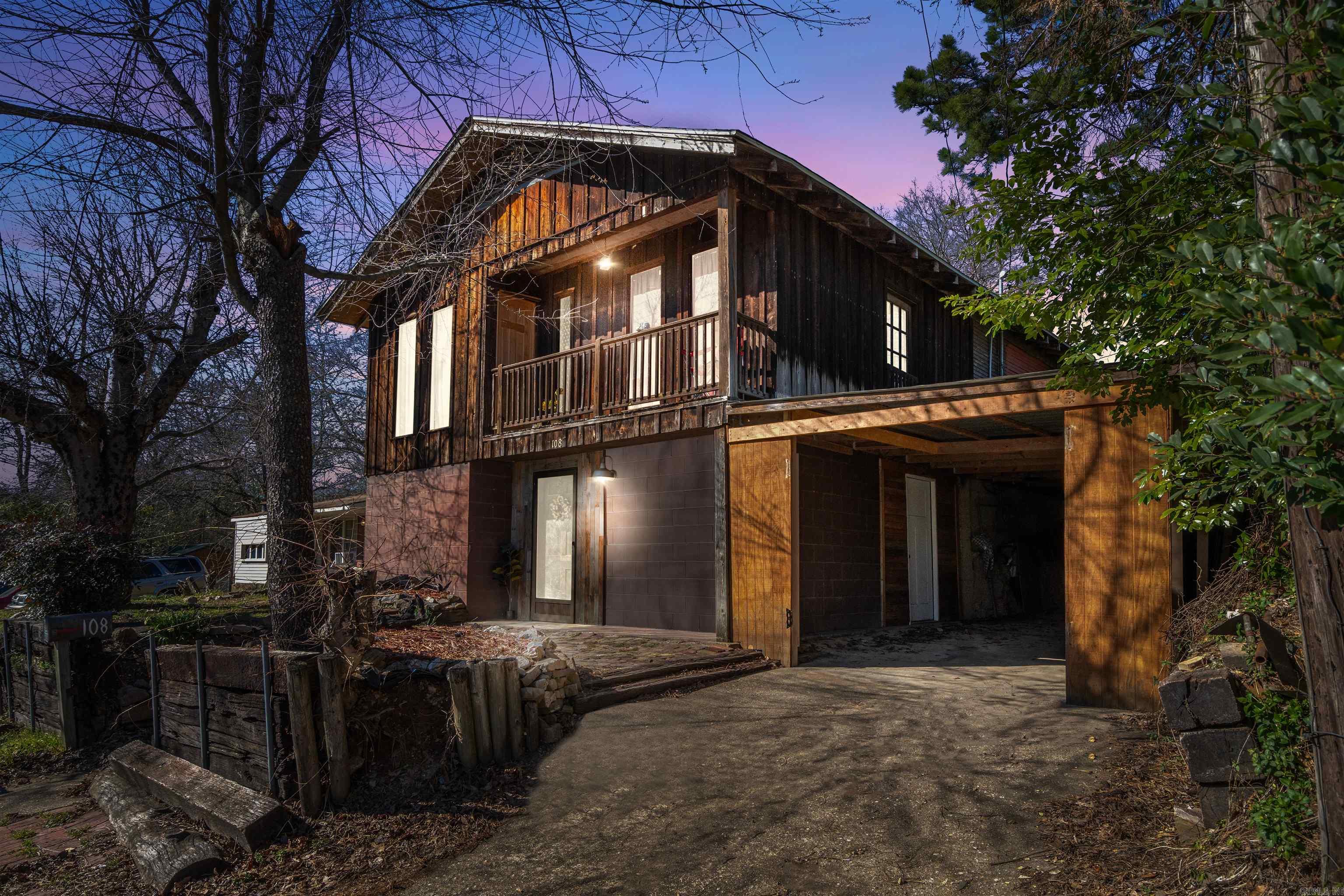 Nestled in the heart of Hot Springs, this unique home is full of character and charm! Located just minutes from the downtown historic Bathhouse Row, Oaklawn Racing & Casino, as well as other local attractions. You'll be right in the center of it all. Step inside to an open, airy space filled with ample natural light, creating a warm and inviting atmosphere. Enjoy your morning coffee on the balcony or unwind on the back deck, surrounded by the soothing sounds of nature and chirping birds. Experience the perfect blend of historic charm and modern comfort in this one-of-a-kind home!