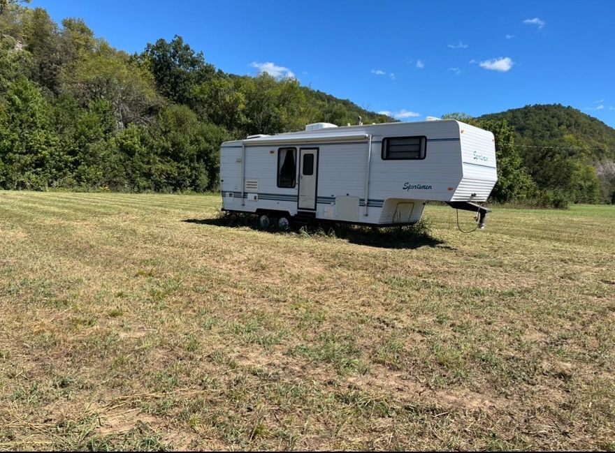 Peaceful, Serene, Beautiful lot across from the White River in Guion! About 3 miles from the boat launch, it is a great location for a getaway or an air bnb! Lot comes complete with a 5th wheel and brand new electric hook up!