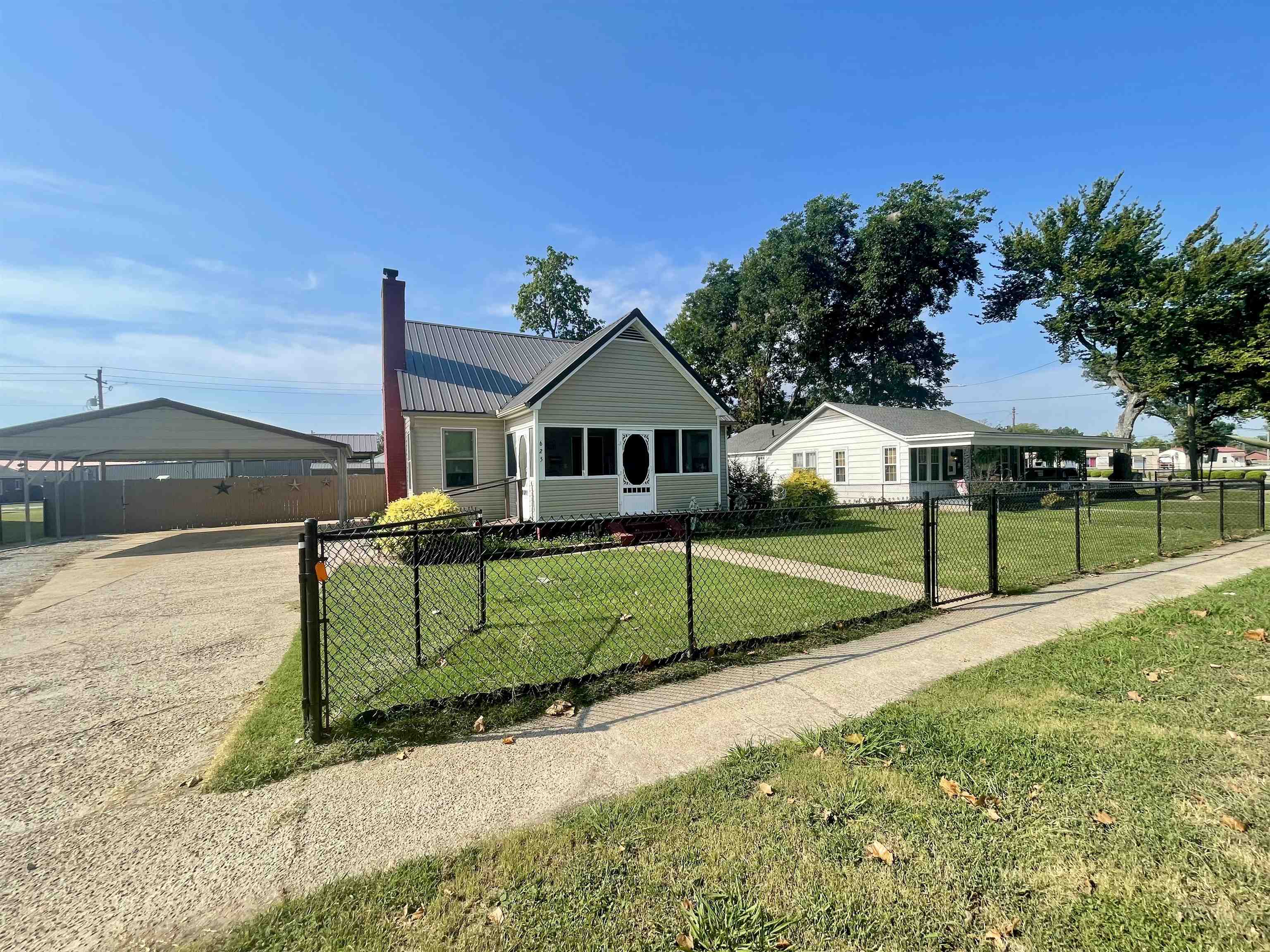 This home has tons of character and tons of space! With 4 bedrooms, 2.5 baths, large living room, formal dining room, spacious kitchen, and a bonus room, you'll have plenty of space to spread out. The primary suite, a full hall bath, and a guest bedroom are located on the main level. Upstairs there are two additional bedrooms, a half bath, and a bonus room. Some of the seller's favorite things about this home are the kitchen with many cabinets, including 4 lazy susans, and the storage available in the floored attic space that is easily accessible from the bonus room and the half bath upstairs. The exterior amentities include a screened front porch, a two car carport in the front of the home, another carport located inside the fence for convenience, a storage shed, a shop, and a good sized, fully fenced in back yard. There have been many major updates in the recent years including, new vinyl siding, metal roof, all new windows, guttering, HVAC units, water heaters, carports, screened porch, dishwasher, some flooring, and more. This home is ready for a new owner to bring their own touch to the inside and make it their own. Call your favorite REALTORĀ® and schedule your showing!