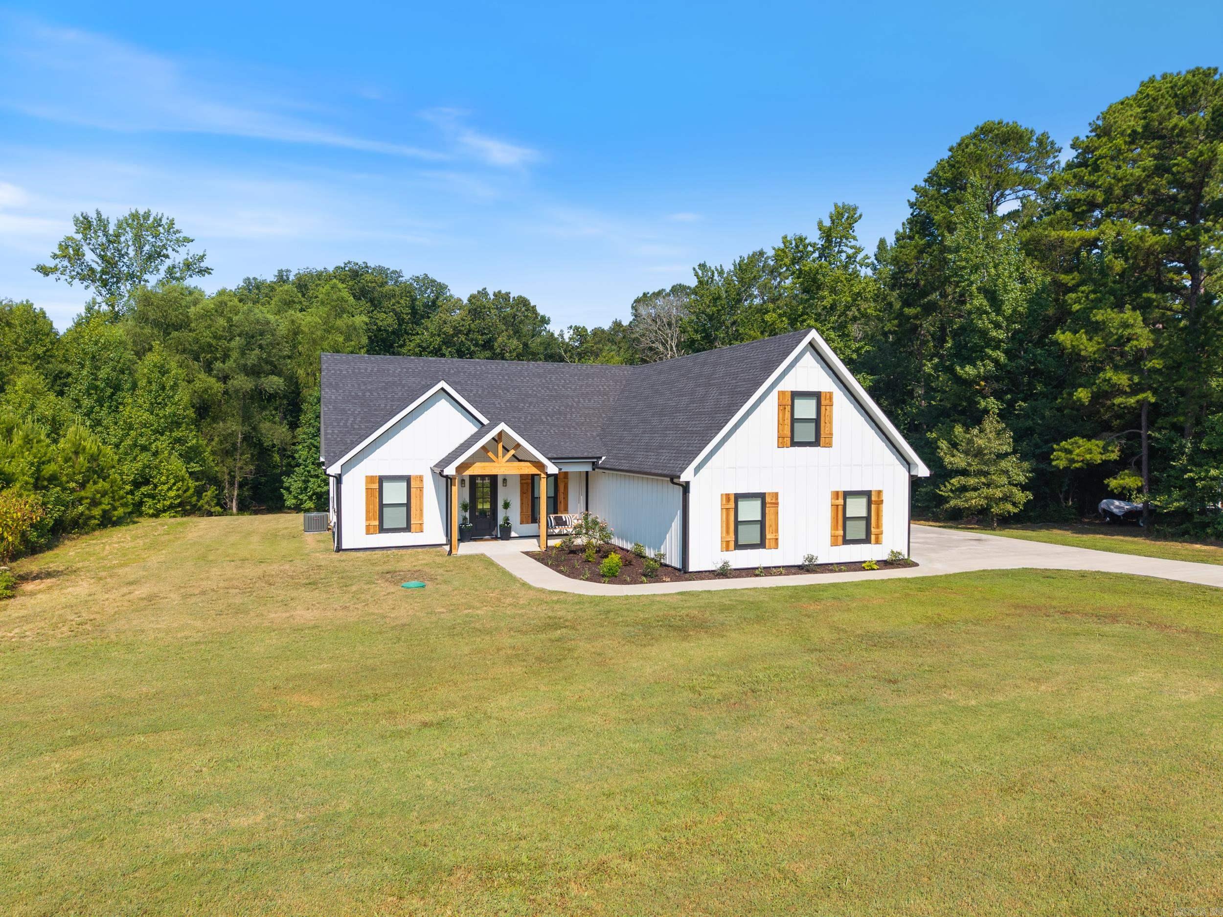 Discover the charm of 390 Valley Creek Drive, a stunning residence crafted in 2023, offering a harmonious blend of modern luxury and serene country living. Set on over 7 acres, this property provides ample space and tranquility. The home features custom inset cabinets that add a touch of elegance to the kitchen, while the newly installed luxury vinyl flooring in April 2025 ensures a stylish and durable foundation throughout. The thoughtful split floor plan includes three spacious bedrooms downstairs, providing privacy and comfort for family living. Upstairs, a bonus room with a bathroom and closet, completed in July 2025, offers additional flexibility, perfect for guests or a home office. Safety and peace of mind are paramount with the inclusion of a storm shelter. Embrace the beauty of custom designs throughout this exquisite home, where every detail is crafted for comfortable and sophisticated living. See agent remarks, & Schedule your showing today!