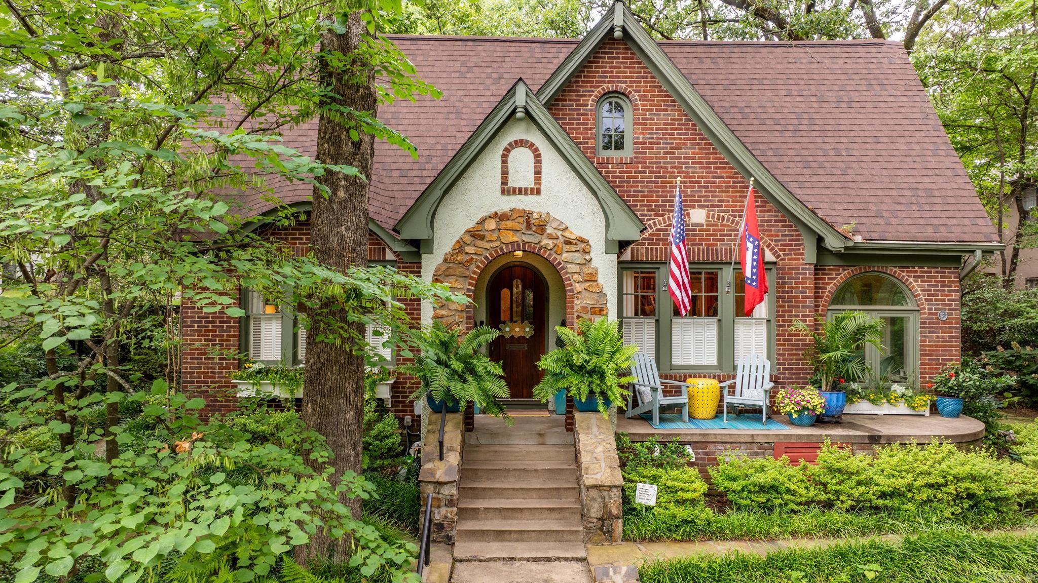 An iconic treasure in the heart of Hillcrest, this spectacularly restored 4-bedroom, 3-bathroom home, known as the JSM Cannon Home, blends historic charm with high-end modern updates. The spacious living room features a fireplace with gas logs and beautiful windows. This opens to a formal dining room and a music room/study with adjacent sunroom that features custom copper penny flooring and abundant natural light. The custom designed chefās kitchen is a showstopper, including beverage fridge in the island and cozy banquette. Kitchen keeping room opens to patio, lawn and fenced backyard. Three bedrooms and two full baths on main level plus laundry. Upstairs, the luxurious primary suite includes spacious sitting area, spa-inspired bath, two walk-in closets, reading nook with custom library shelves, daybed and laundry/craft room. Incredible landscaping with multiple outdoor porches and patios offer space to entertain or relax. Additional highlights include two-car garage and storage area with alley access, newer roof (2019). Featured in At Home in Arkansas Magazine, every inch of this home has been thoughtfully curated with custom finishes and details. *Agents see remarks.