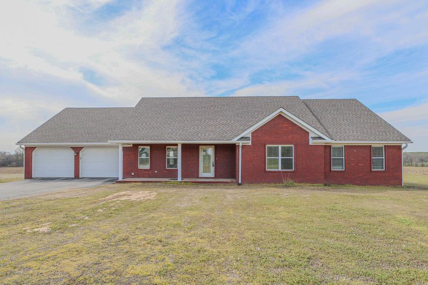 Experience the epitome of country living! This captivating all-brick home boasts spacious elegance, nestled on a generous 1.52 acres of land. With a two-car garage, storage building, and a sizable 24x36 shop equipped with electric and two lean-tos, your dreams of rural tranquility come to life.  Embrace modern comfort with recent upgrades including a new roof in 2023, an HVAC system installed in 2018, water heater refreshed in 2020 along with new paint in 2024. The heart of this home lies in its inviting kitchen, complete with a breakfast room and  appliances. Entertain guests in style within the formal dining room or unwind by the gas log fireplace in the expansive living area.  Step outside to discover a covered back porch, offering the perfect vantage point to soak in the breathtaking views of the surrounding countryside. Welcome to your idyllic sanctuary amidst nature's splendor.