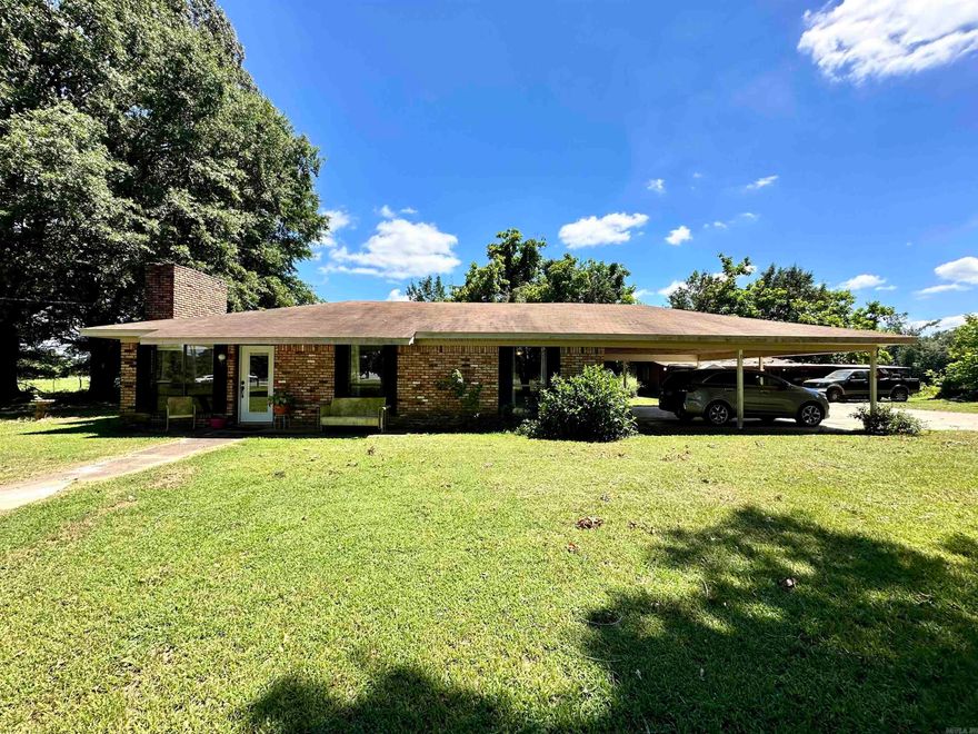 Discover the serenity of country living at 131 Stone Rd. This charming 1369 sq ft home sits on 1.91 acres of lush countryside and features two cozy bedrooms, an updated bathroom, and an office/bonus room that could be converted to a third bedroom. Enjoy cooking in the kitchen with a gas range, and relax on the inviting patio after a long day. The property includes an attached two car carport, extra storage closets, and a workshop/storage building, offering ample space for all your excess storage and tinkering needs. This home is just minutes away from health care, restaurants, shopping and so much more. Experience the perfect blend of rustic charm and comfort in this southern home.