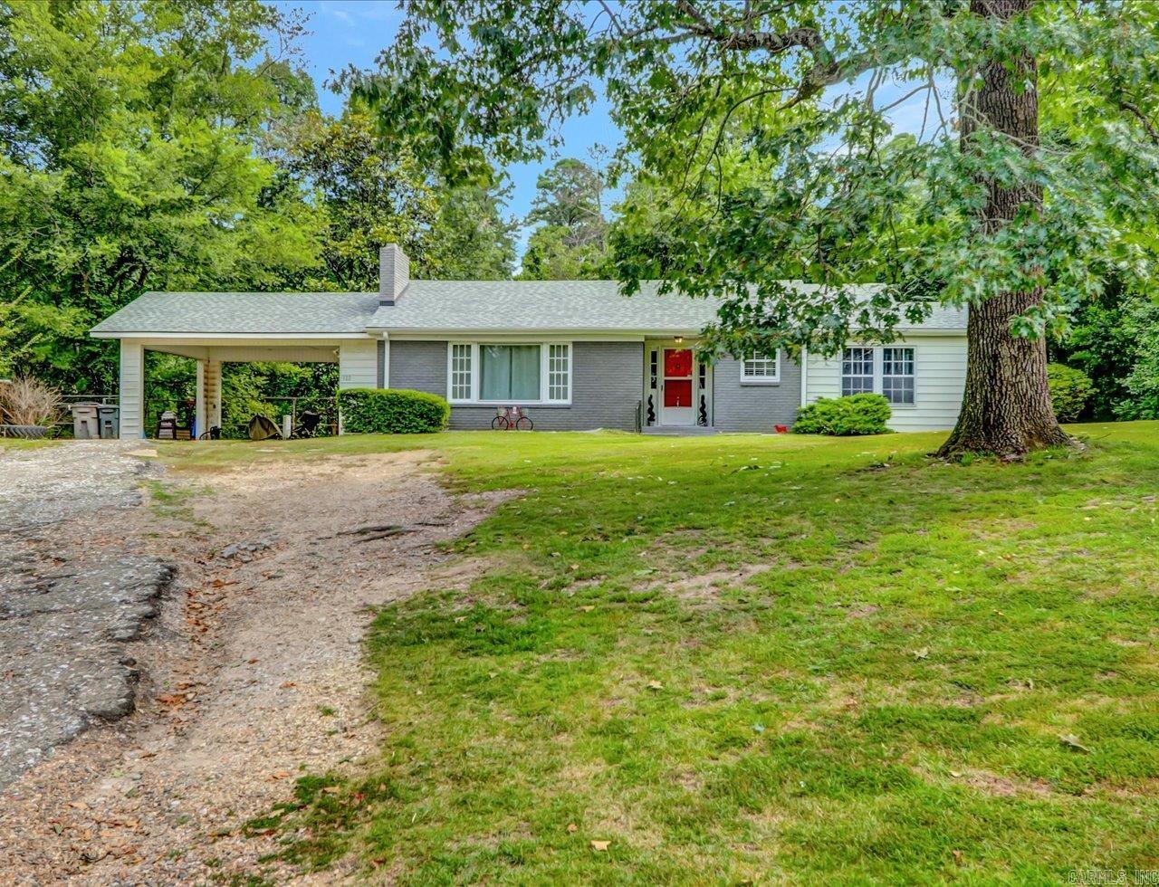 LIVE IN THE NATIONAL PARK! 1950 Original Ranch set back from the road on Circle Drive! Situated on 3/4 of an acre. Solid brick home with basement and 2 car carport. Original tile in the bathrooms & original oak floors for vintage seekers. Wood burning fireplace in living room. Gas stove for cooking with electric water heater and heat pump. Large brick patio in the back for the wooded views. The property can be cleared down to the wire fence at the bottom, on the property line, to create the park feeling to match the front. Being inside the National Park and near Northwoods trail Mt Bike trail along with all the trail systems nearby, bring the park to you! NEW ROOF!