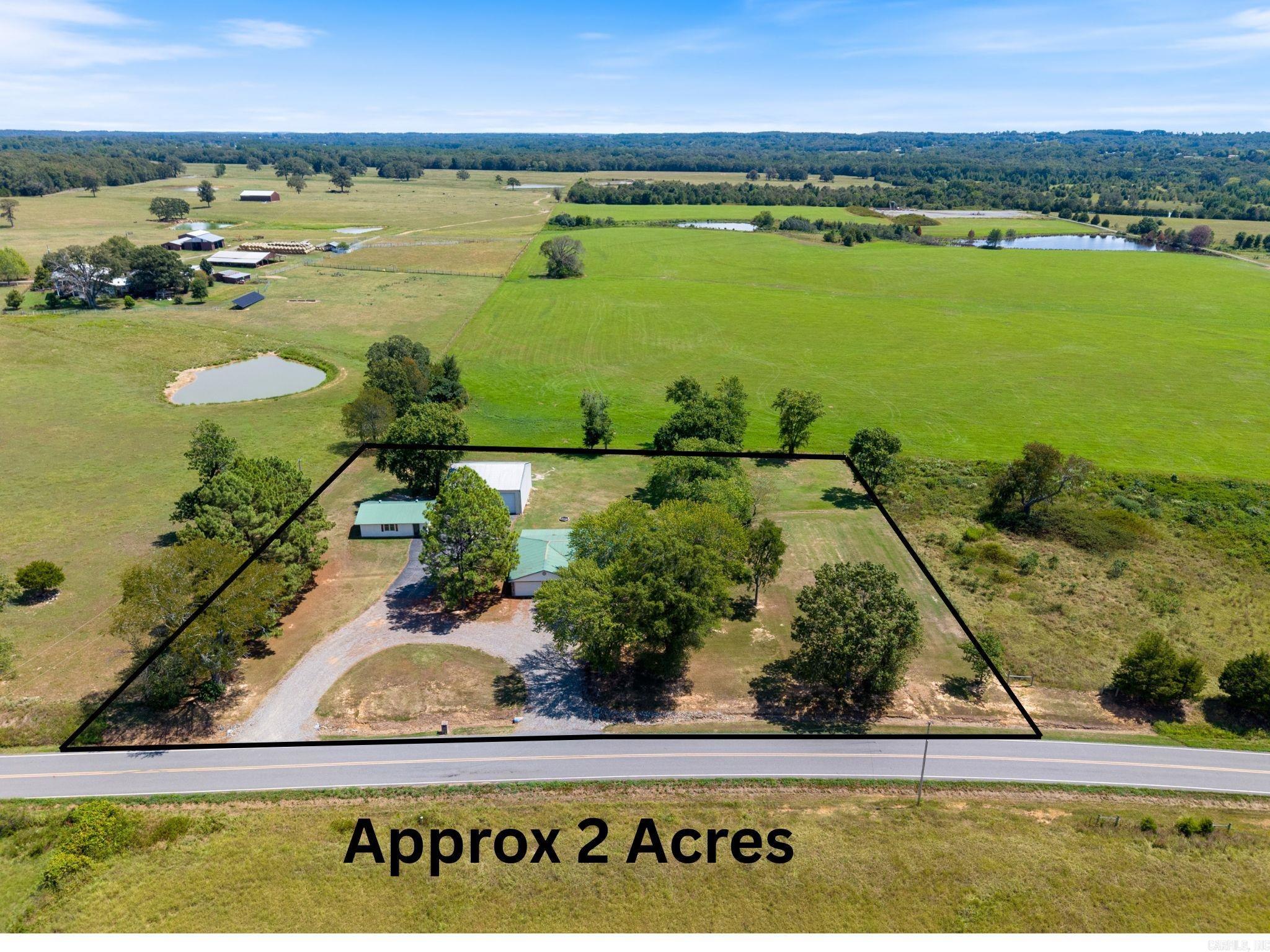 Enjoy country living with modern updates and swoon-worthy OUTDOOR Shop space! This brick home sits on an open 2 acres with unobstructed views, mature shade trees, and plenty of room for animals or gardening. Inside, the farmhouse-style kitchen features a breakfast bar, stainless appliances, and adjoining dining nook. Enjoy the spacious living room, 3 bedrooms, 2.5 baths, and a Spacious Walk-In Closet. The addition on the back with an outside entrance is perfect for an in-law suite, exercise room, game room/bonus room, 4th bedroom, or home office. New HWH (2025). Outdoors, the setup is a dream: a 28x32 concrete block shop plus a massive 40x40 RV Workshop with 12-ft doors and paved drive ā perfect for RVs, boats, equipment, or a home business. The oversized attached 2 car garage adds even more storage and function. Whether youāre looking for hobby space or quiet country living, this property delivers both comfort and opportunity. Conveniently located near town while maintaining peaceful privacy! No mineral rights to convey