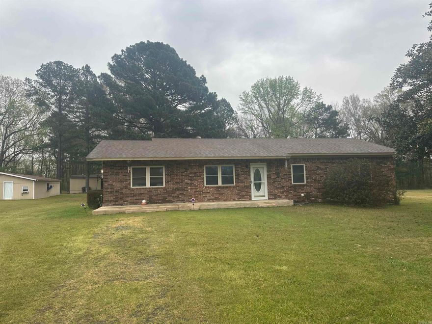 Well maintained and loved home by original owners on this absolutely beautiful piece of land!  Level yard with trees, outbuildings and sheds for all your gardening needs. And a perfect garden spot! Azaleas blooming the spring! You can also have a baseball field here for the kids!  All brick solid home with updates to include flooring, windows, roof, and both bathrooms remodeled!  Spacious open living area plus a separate den with fireplace.  Peaceful covered patio to enjoy cool evenings.