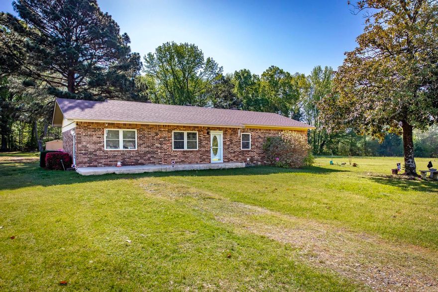 Check out the new pictures!  Well maintained and loved home by original owners on this absolutely beautiful piece of land -2.3 acres!  Level yard with trees, outbuildings and sheds for all your gardening needs. And a perfect garden spot! Azaleas blooming the spring! You can also have a baseball field here for the kids!  All brick solid home with updates to include flooring, windows, roof, and both bathrooms remodeled!  Spacious open living area plus a separate den with fireplace.  Peaceful covered patio to enjoy cool evenings.