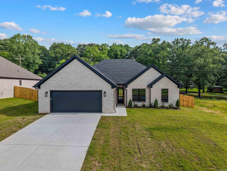 This home is close to schools and downtown Benton. Has LVP flooring, granite countertops, large walk in pantry, island over looking great room. Primary has custom tile shower and free standing tub. has 1/2 bath off of kitchen. Other bedrooms are large with over sized closets. Home comes with privacy fence.        lvp flooring