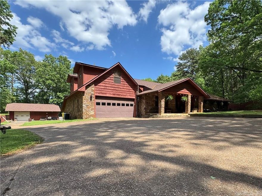 Beautiful waterfront retreat with private dock and covered boat slip, offering stunning lake views and peaceful surroundings. This spacious 4,000+ sq ft home features a warm wood-paneled living area with fireplace and a downstairs rec room with pool table—perfect for entertaining. Enjoy outdoor living with an outdoor kitchen overlooking the inground pool, expansive decks, and a large, level yard. Property includes a 30x40 shop with full bath, plus additional space for hobbies or storage. Primary suite and multiple bedrooms provide ample room for family or guests. Ideal as a full-time home, weekend getaway, or investment property.