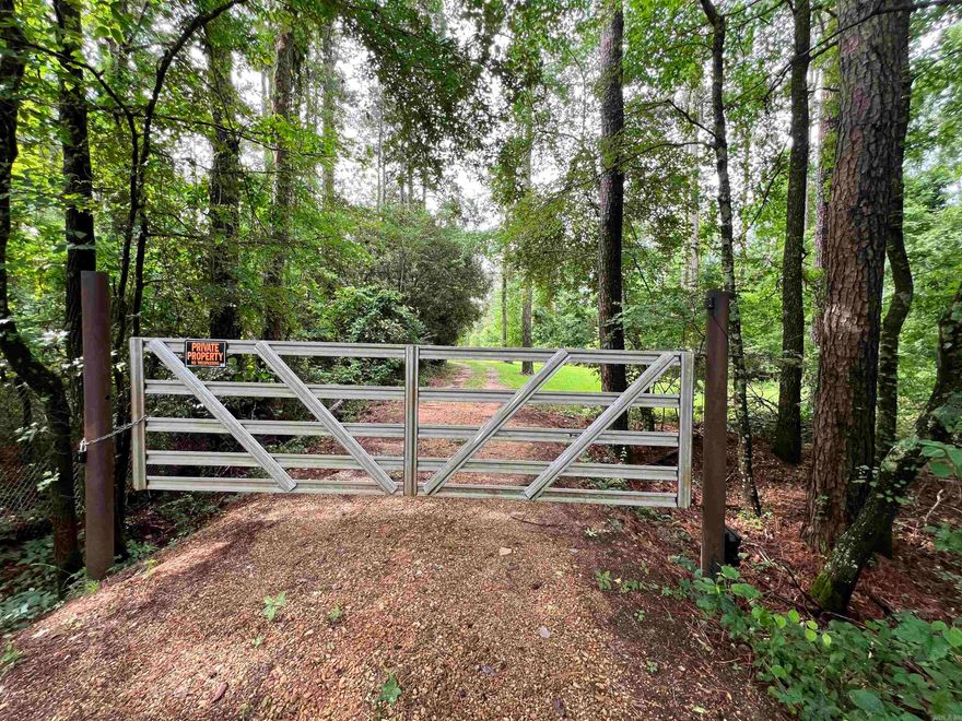 Completely Private and PERFECT!  This 3400+ sq ft home has 5 bedrooms, 3 full bathrooms, Formal Living and dining rooms, massive kitchen, separate laundry room, family room with built ins and woodburning fireplace AND A WET BAR!  TONS of space, TONS of storage all on 10.19 Acres of lush greenery and pond. Did I mention STORAGE? It also has 3 outside storage/garage buildings, barn and luxury dog house.  There's so much potential in this property! Customize your sanctuary! Every buyers' DREAM located within ONE MILE of Star City center and tucked away from everything. Truly must see to appreciate.