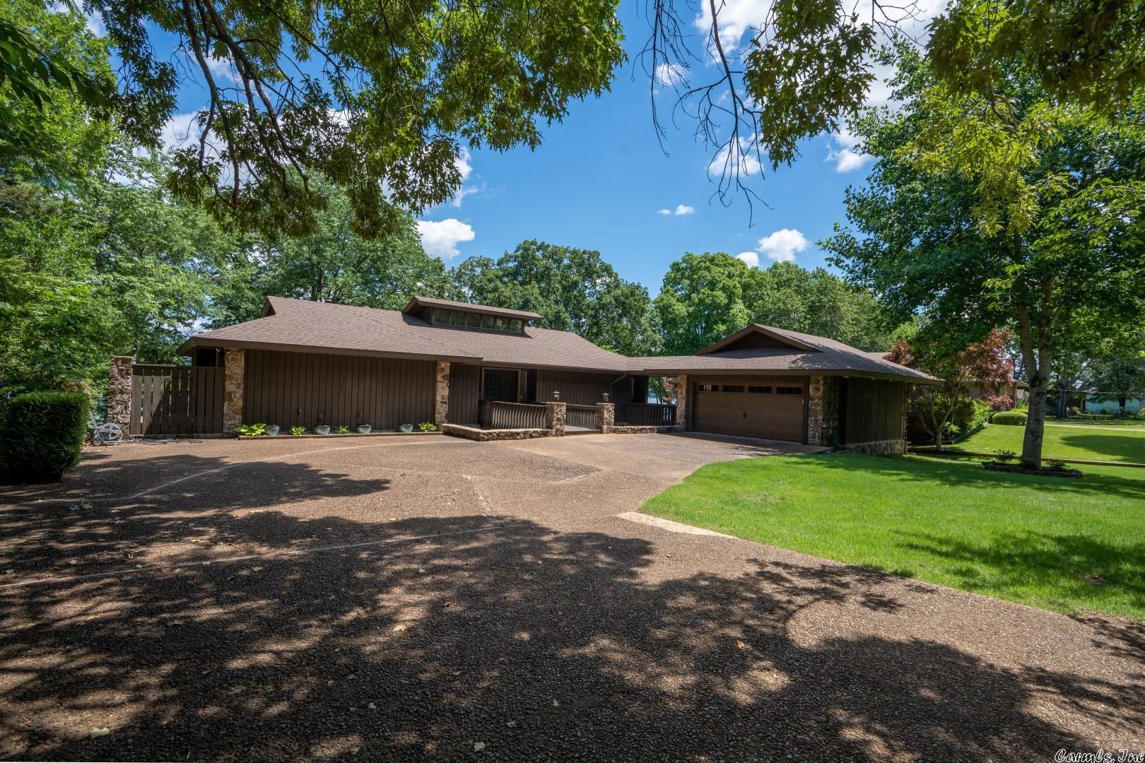LAKEFRONT with magnificent lake views!!! This home has had every surface touched in the last few years! Completely updated and completely furnished! Master on the main level, 2 large bedrooms down plus 2 additional rooms down with beds (one with bunks). Two living areas, views from all bedrooms, wonderful screened porch, amazing kitchen, cathedral ceilings, 2 fireplaces, 2-car garage, ample parking and much more. Every bit as beautiful as the pictures portray!