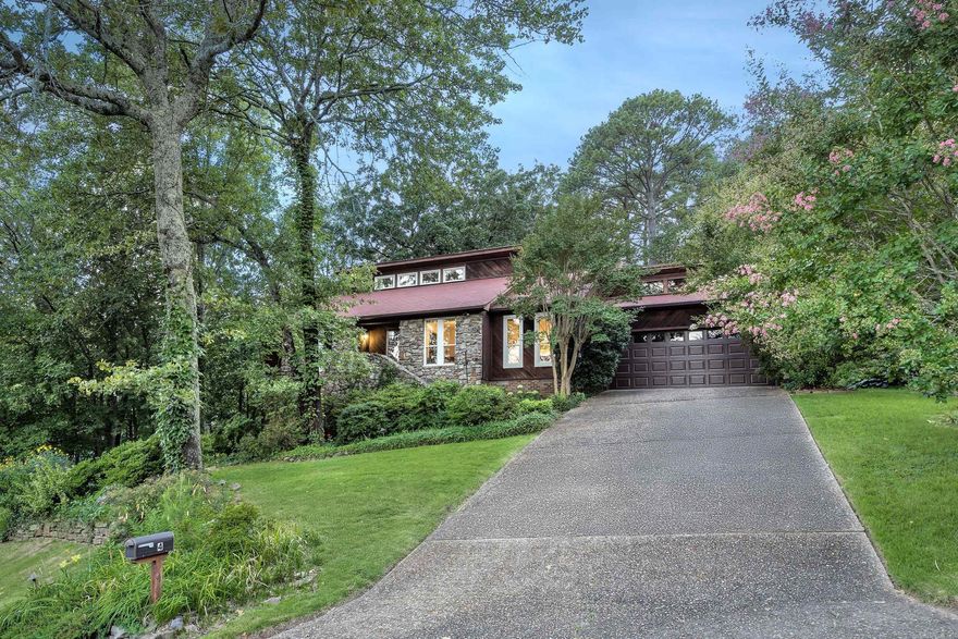 Beautifully updated 3-bed, 2-bath home in the desirable St. Charles neighborhood, just steps from the community park and pool. This 2,400± sq ft home offers a modern interior with high ceilings, custom lighting, and rich flooring throughout. The open kitchen boasts sleek cabinetry, quartz counters, a center island, and stainless appliances—all opening to bright dining and living areas perfect for entertaining. The primary suite includes a spa-like bath with dual vanities, a jetted tub, walk-in shower, and a private sitting area with wooded views. Two additional bedrooms offer flexible space for guests, work, or hobbies. Outside, enjoy a wraparound deck nestled in the trees, ideal for morning coffee or evening gatherings. A dedicated office with built-in shelving, generous storage options, and thoughtful updates throughout complete the package. With direct access to neighborhood trails, top-rated schools, and local amenities, this home blends comfort, style, and location.