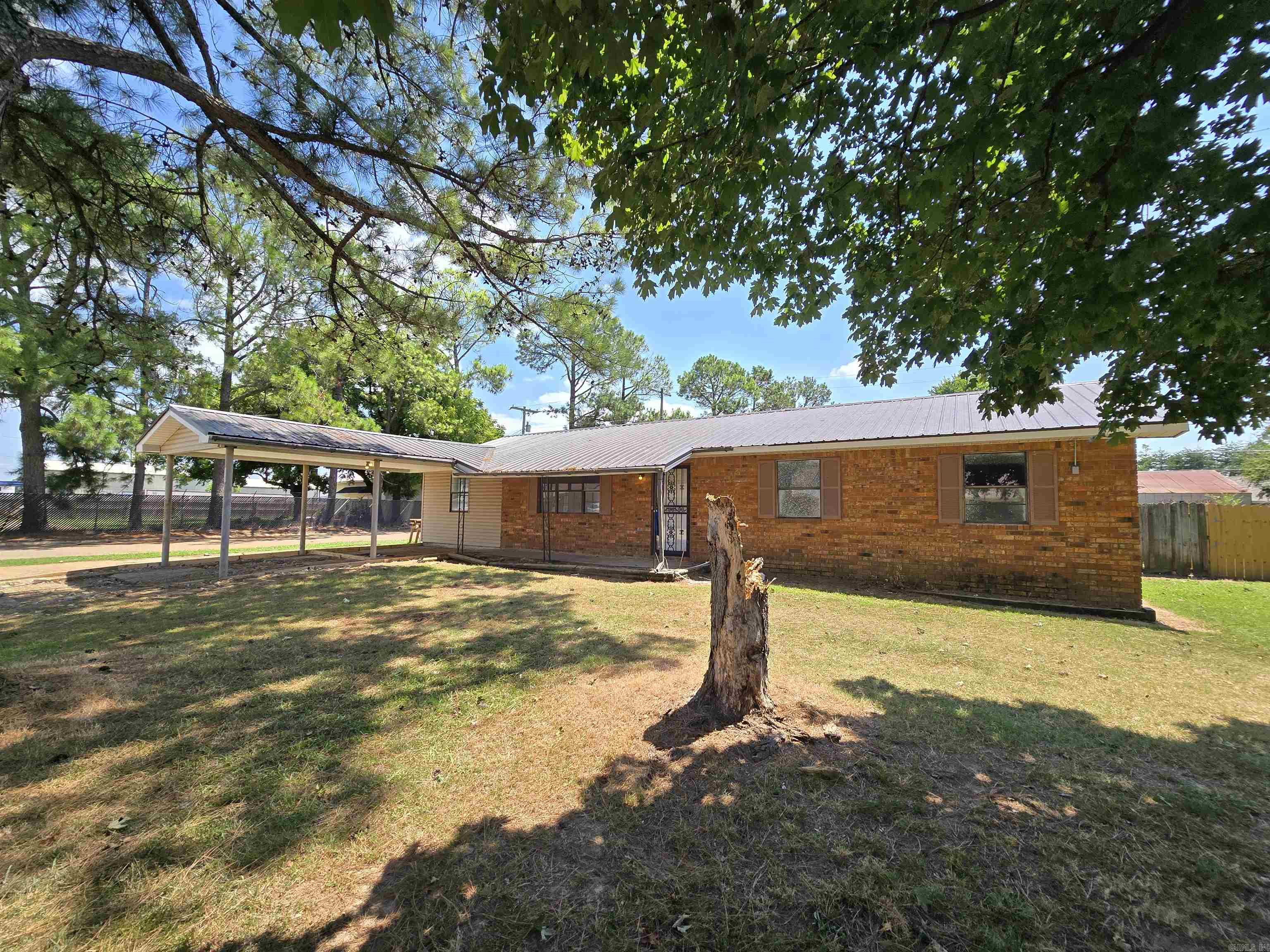 Completely updated sound good to you? Come see this 4 bedroom , 2 bath home that has been made new! Paint, sheetrock walls & ceilings, flooring, kitchen appliances, lighting, fixtures, tubs, sinks, toilets, water heater, heat and air complete and windows yet to be installed. There is a covered patio out back with room for a grill and extended covered parking out front too. All of this on a corner lot!
