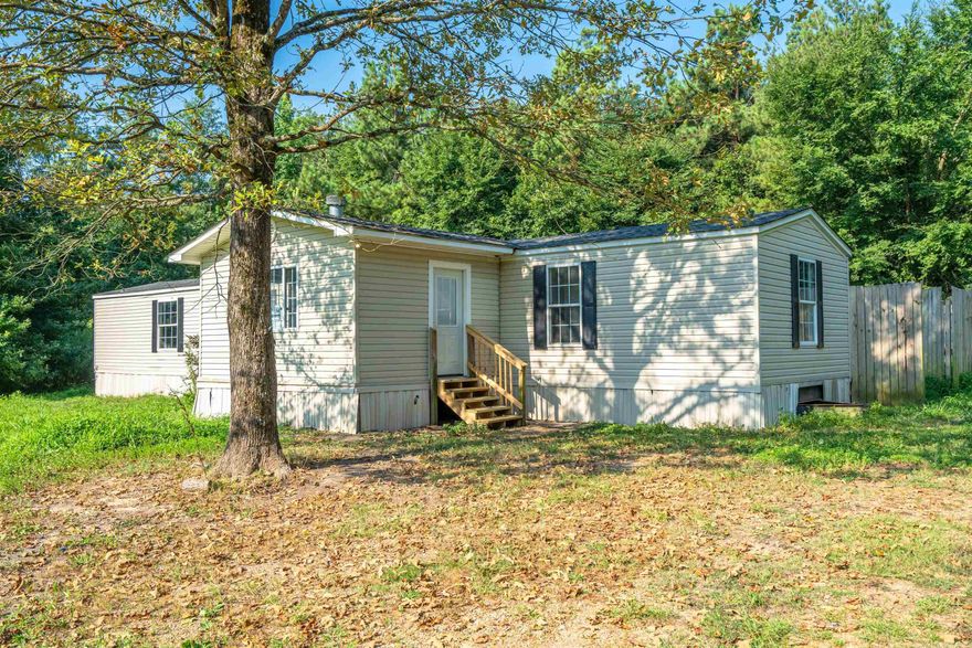 Cute  remodeled mobile home in the country  but close to conveniences. New paint & floors.  Move in ready with 3 bedroom 2 bath  with wood burning fireplace.