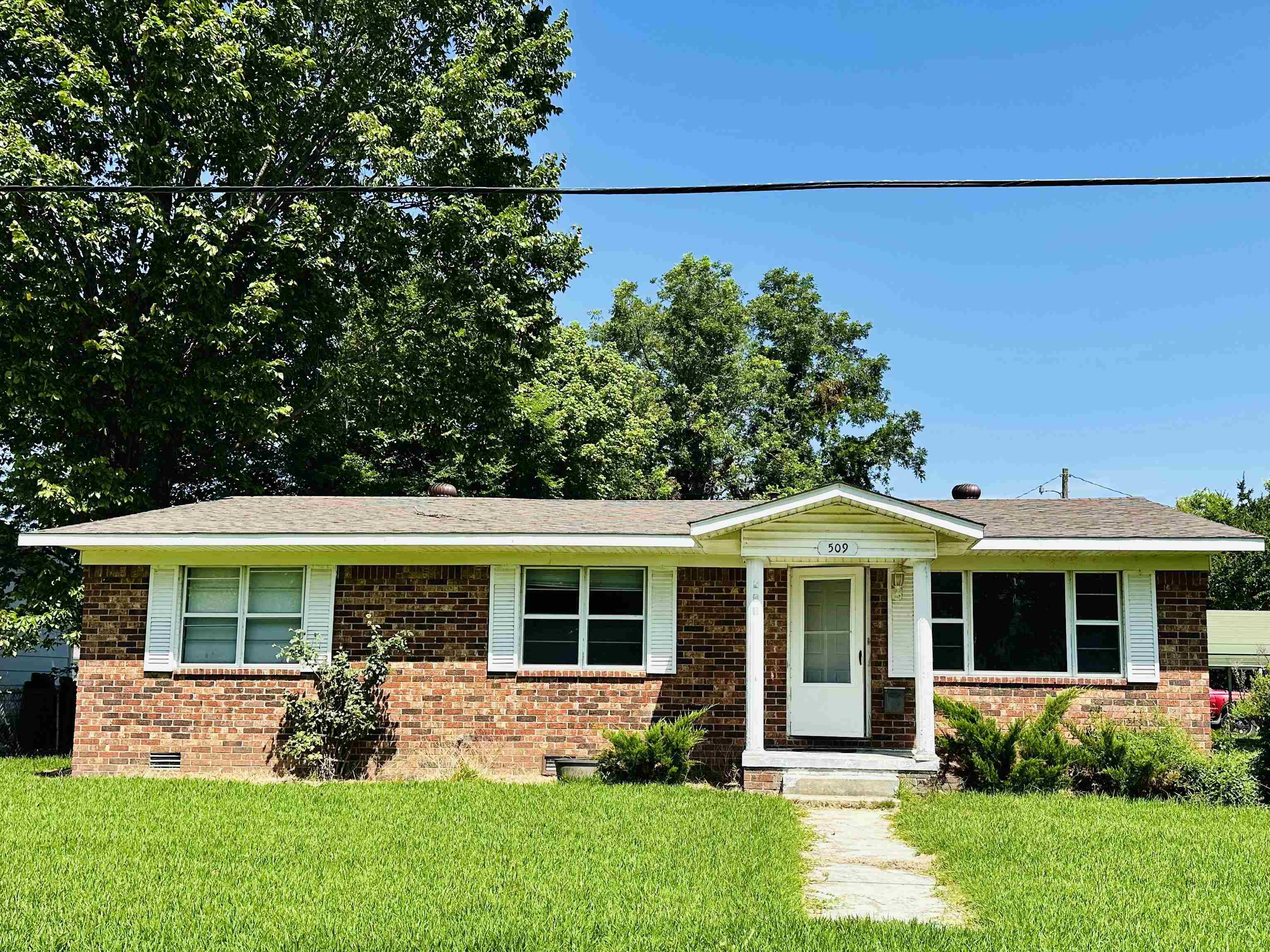 Income-producing investment property on a large corner lot! This all-brick home features 3 bedrooms, 1 full bath, and an additional half bath. The spacious interior includes a large kitchen, with a dining room, and inviting living room. The sunroom offers versatility and could easily serve as a 4th bedroom, office, or bonus space. A dedicated laundry room adds functionality. With strong rental history and solid structure, this home is a great opportunity for investors looking to expand their portfolio.