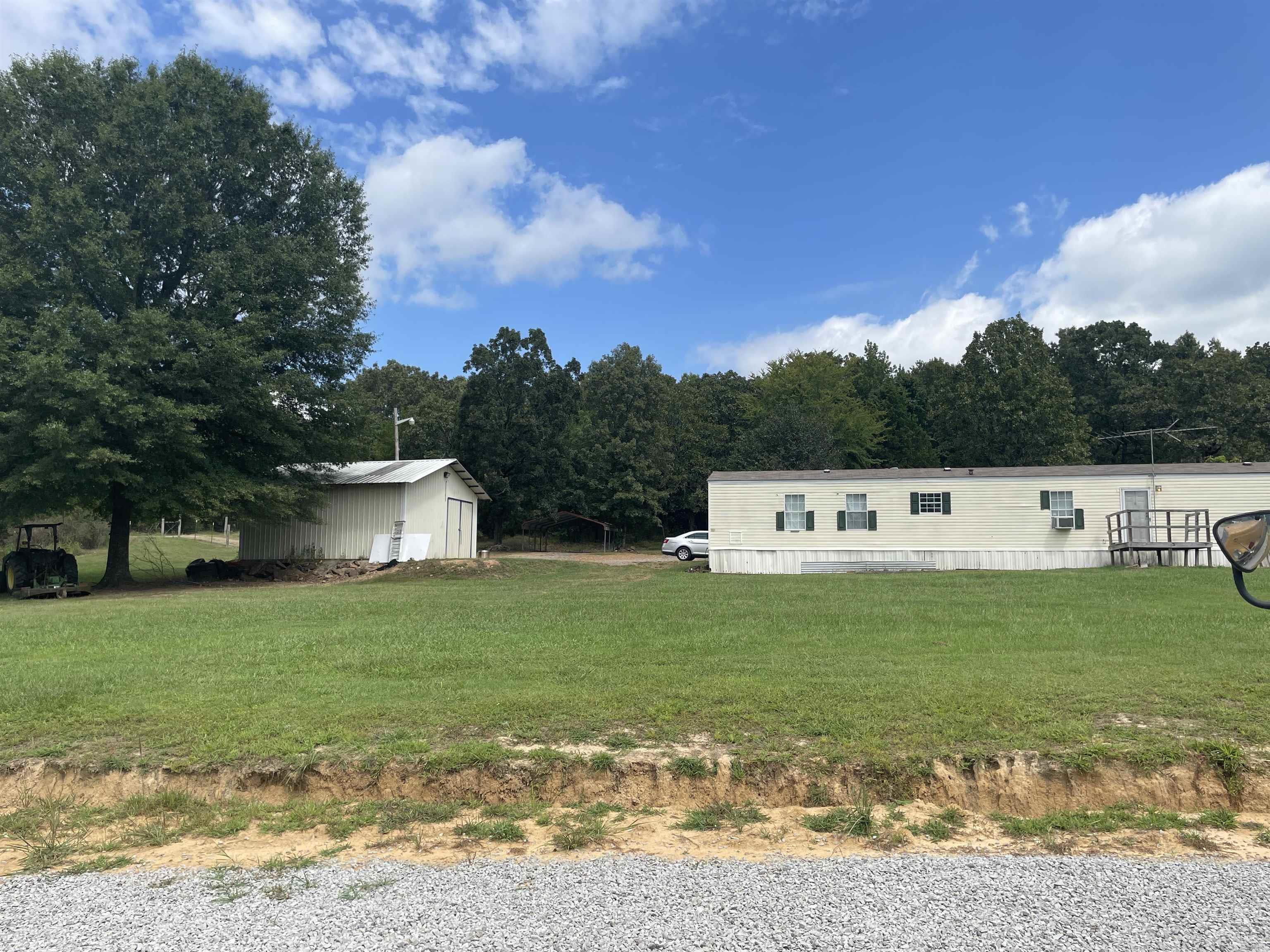 Other listing for 105 Deer Hill can be purchased as 7+ acres with 4800sf shop -or- separately here for 2.58 acres, single wide mobile home, and concrete slab, wired, shop.