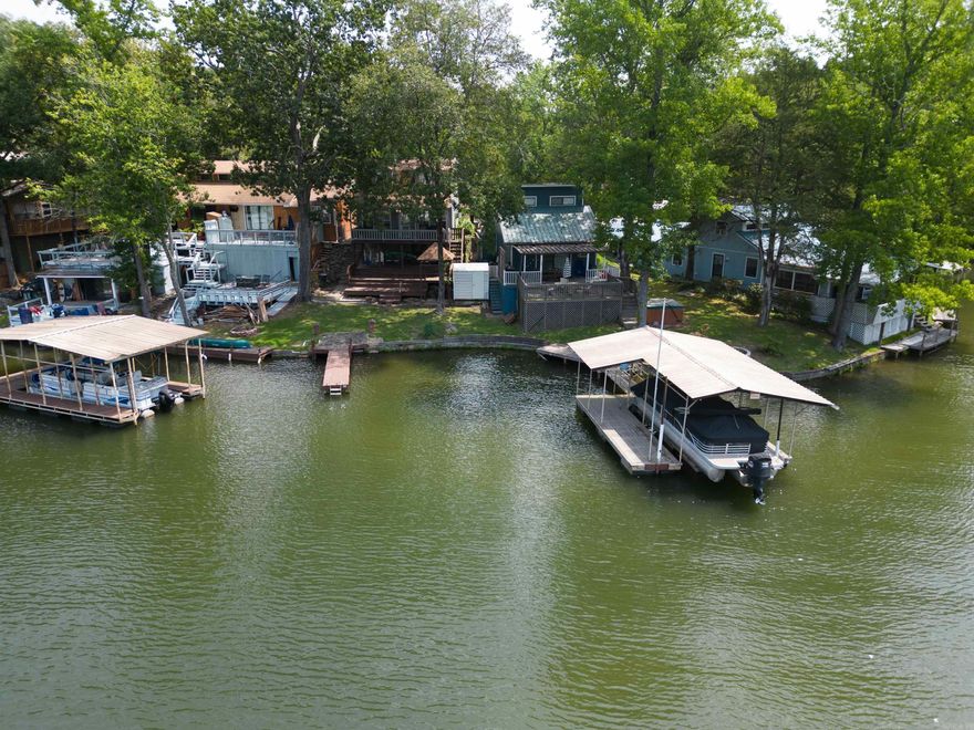 What a cozy little retreat on Lake Hamilton! This home is laid out well and can host quite the gathering! It comes fully furnished with lots of great decorations and furniture!  The serene views and water make it the perfect getaway and home away from home!  Or maybe you want to invest and use it as a rental or ABnB!  There is a swimming dock for easy access to the water.  The covered deck will offer a nice reprieve while you sip coffee in the morning or choose to have dinner with nature!  Home next door is also for sale, #436.  MLS #23023315.  See Agent Remarks!