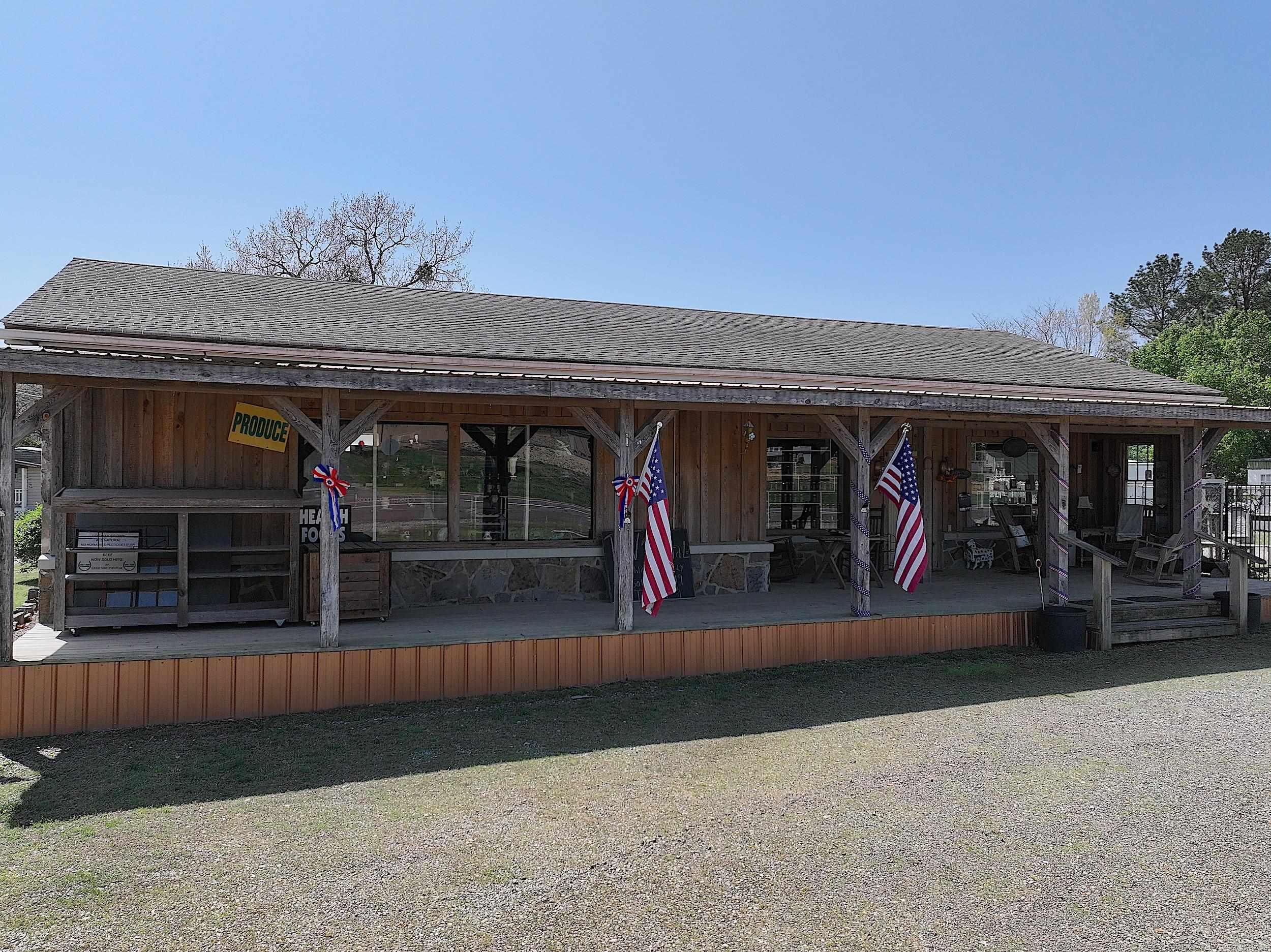 This diverse income-generating property at 3551 Hwy. 270 E. offers a rare mix of residential and retail potential. Currently operating as Marilyn’s RV Park and Old Country Store, the site features two mobile homes leased on a monthly basis, along with 16 fully equipped RV spots available for short- or long-term stays. The on-site store comes fully stocked, offering a wide range of goods including chilled and frozen groceries, seasonal produce, wellness supplements (NOW), organic product lines (Rowe Casa), and an array of unique gifts and specialty items. Everything on the premises—inventory, equipment, and furnishings—is included with the sale, making this an ideal opportunity for a smooth, immediate transition. *Owner may remove some items from the antique side prior to closing. Owner is retiring; listing is being sold as-is.
