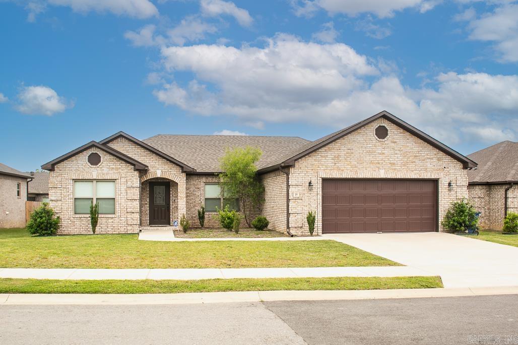 What a wonderful place to call home...and it can be yours! This lovely three bedroom, two bathroom home features laminate flooring in main living spaces as well as the primary suite, tile in wet spaces, and carpet in guest bedrooms. Enjoy the over-sized living room complete with electric fireplace and ample space for a second sitting space just off the entryway. The kitchen features plenty of granite counter top space, one basin farmhouse sink, under cabinet lighting, and easy access to the laundry space and two car garage. You will enjoy the extra space in the primary bedroom, the soaking tub and walk in shower in the primary suite as well as the large walk in closet space. The guest bedrooms sit apart and provide extra space for comfort. The Fall evenings will be delightful under your covered back patio too! Be sure to schedule your showing today!