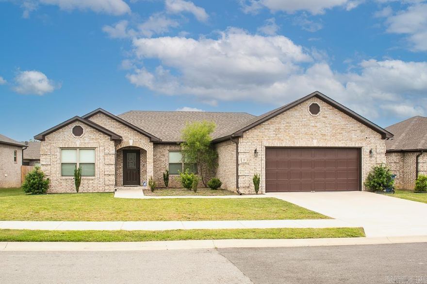 What a wonderful place to call home...and it can be yours!  This lovely three bedroom, two bathroom home features laminate flooring in main living spaces as well as the primary suite, tile in wet spaces, and carpet in guest bedrooms.  Enjoy the over-sized living room complete with electric fireplace and ample space for a second sitting space just off the entryway.  The kitchen features plenty of granite counter top space, one basin farmhouse sink, under cabinet lighting, and easy access to the laundry space and two car garage.  You will enjoy the extra space in the primary bedroom, the soaking tub and walk in shower in the primary suite as well as the large walk in closet space.  The guest bedrooms sit apart and provide extra space for comfort.  The Fall evenings will be delightful under your covered back patio too!  Be sure to schedule your showing today!