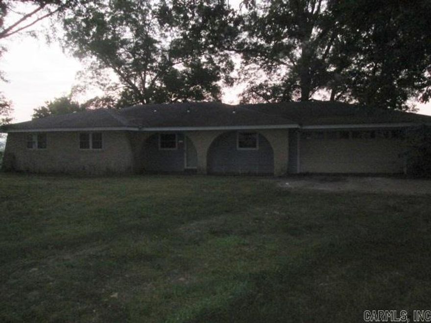 One story three bedroom home. Open living room with brick fireplace and dining room. Kitchen with lots of cabinet space and room for another table. Located on large lot with lots of shade trees.