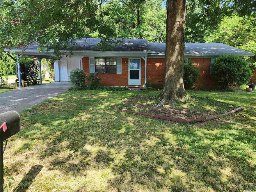 3 BD 1.5 BA brick home on a dead end street. Huge shade trees in the front and back yards, and landscaping make it so enjoyable to be outside. Large carport will fit a 3/4 ton 4 x 4 crewcab truck. Large laundry room and the washer conveys. Kitchen has lots of cabinets and a pantry; plus the refrigerator conveys.