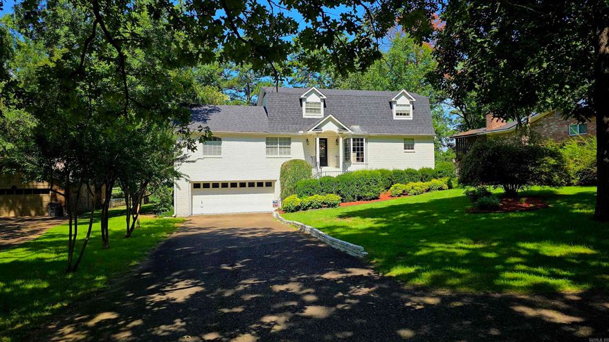 Welcome to the breathtaking Lake Hamilton beauty, a stunning lake house nestled on a level lakefront lot. Situated on the shores of a sprawling lake, this magnificent estate boasts. Upon entering the residence, you'll be greeted by a spacious foyer adorned with tasteful decor and warm, welcoming tones. The open-concept design effortlessly flows from room to room, creating an inviting and airy ambiance. The expansive living room features breathtaking panoramic views of the glistening lake. Adjacent to the living room is the kitchen with ample counter space, offering both functionality and style. The kitchen seamlessly connects to a dining area, perfect for hosting memorable gatherings with family and friends. Four bedrooms of Lakeview Haven are carefully designed retreats, each boasting its own en-suite bathroom for ultimate privacy and convenience. The primary suite is a true sanctuary, featuring a luxurious spa-like bathroom with a soaking tub and a separate shower. Stepping outside onto the lakefront, you'll discover an enchanting oasis. A spacious deck offers the ideal setting for outdoor entertaining and relaxation. The lush lawn leads you to a private dock, where you can enjoy
