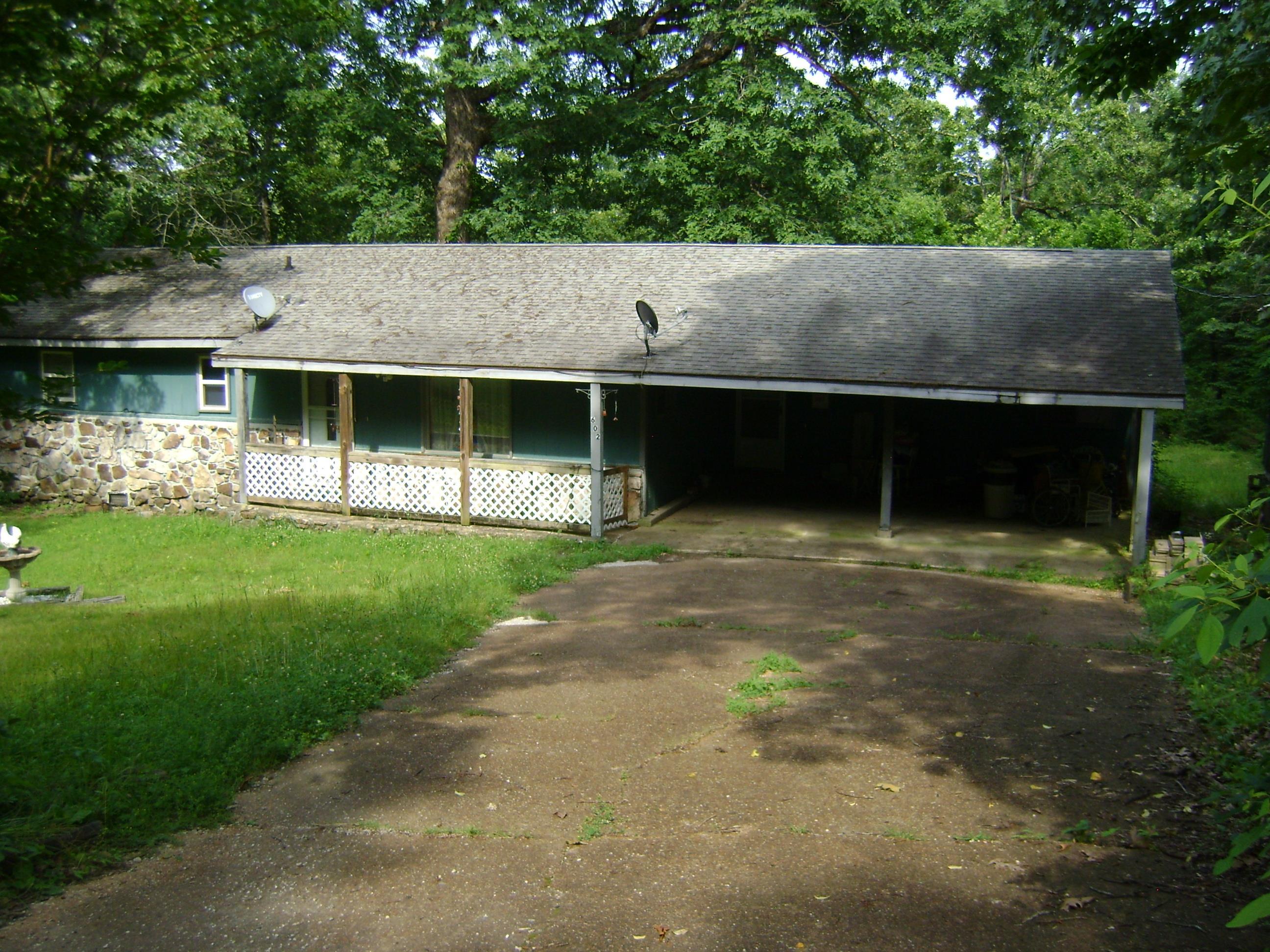 This three Bedroom, two and one half bath house is located in Horseshoe Bend. It has a laundry room, sunroom, living room, dining room, two car carport and a partial basement. Central heat and air, stove, refrigerator, dishwasher, washer, dryer and extra storage. This house needs a lot of TLC from the new owner. It is being sold AS IS, WHERE IS, WITH ALL FAULTS. It is priced to sell.