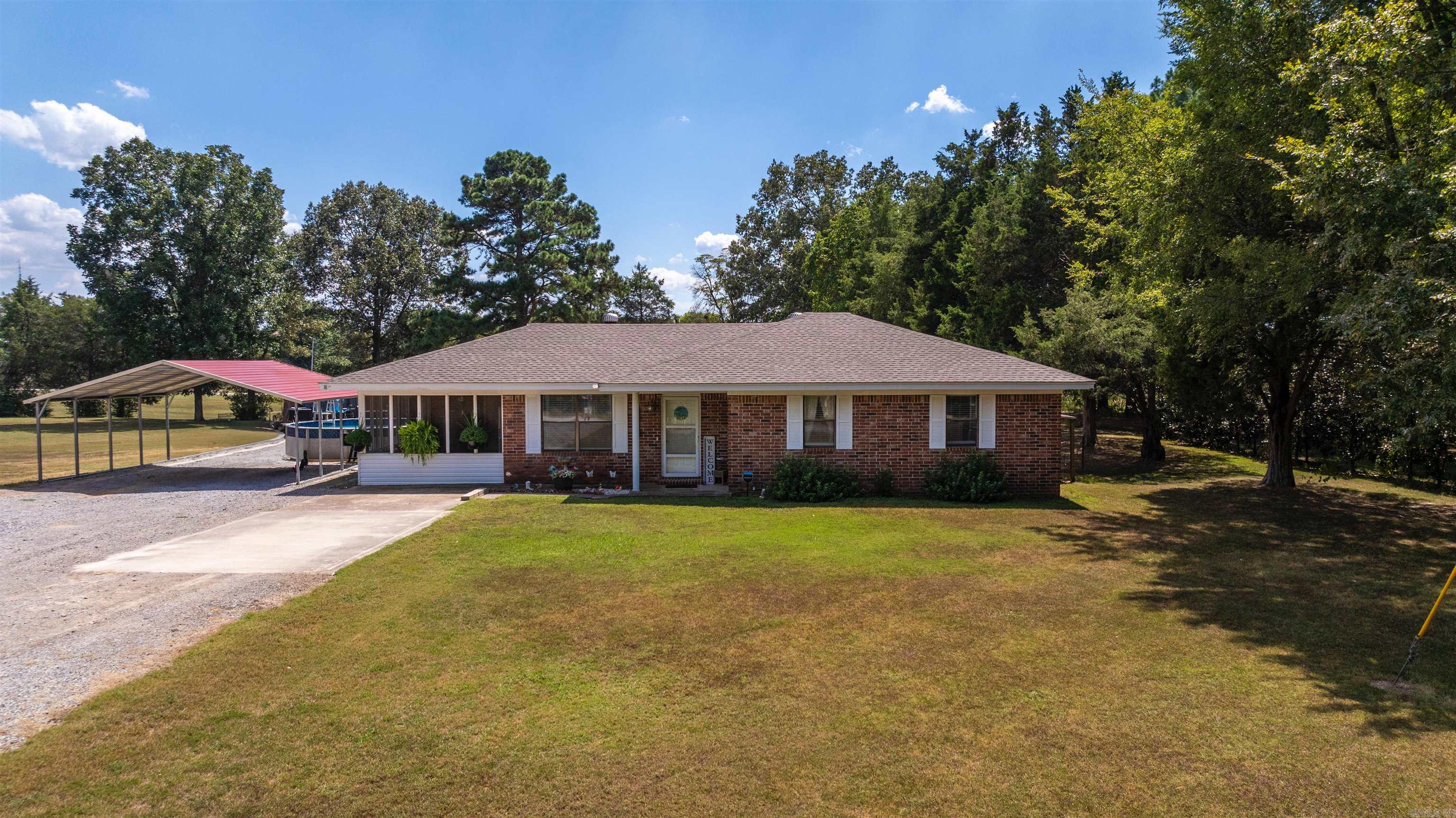 This 3 bedroom, 2 bath brick home sits on a spacious lot with a fenced backyard ideal for kids, pets, and outdoor gatherings. A screened-in porch offers the perfect spot to relax year-round, while the above-ground pool (included) will be ready for summer fun when warm weather returns. Inside, the home features a comfortable layout with a cozy gas log fireplace as a centerpiece. A thoughtful addition expanded the living room, bathroom, and laundry area—providing extra square footage and functionality for everyday living. Whether you're looking for space to entertain, enjoy quiet evenings by the fire, or simply a move-in ready home with great amenities, this property has it all.