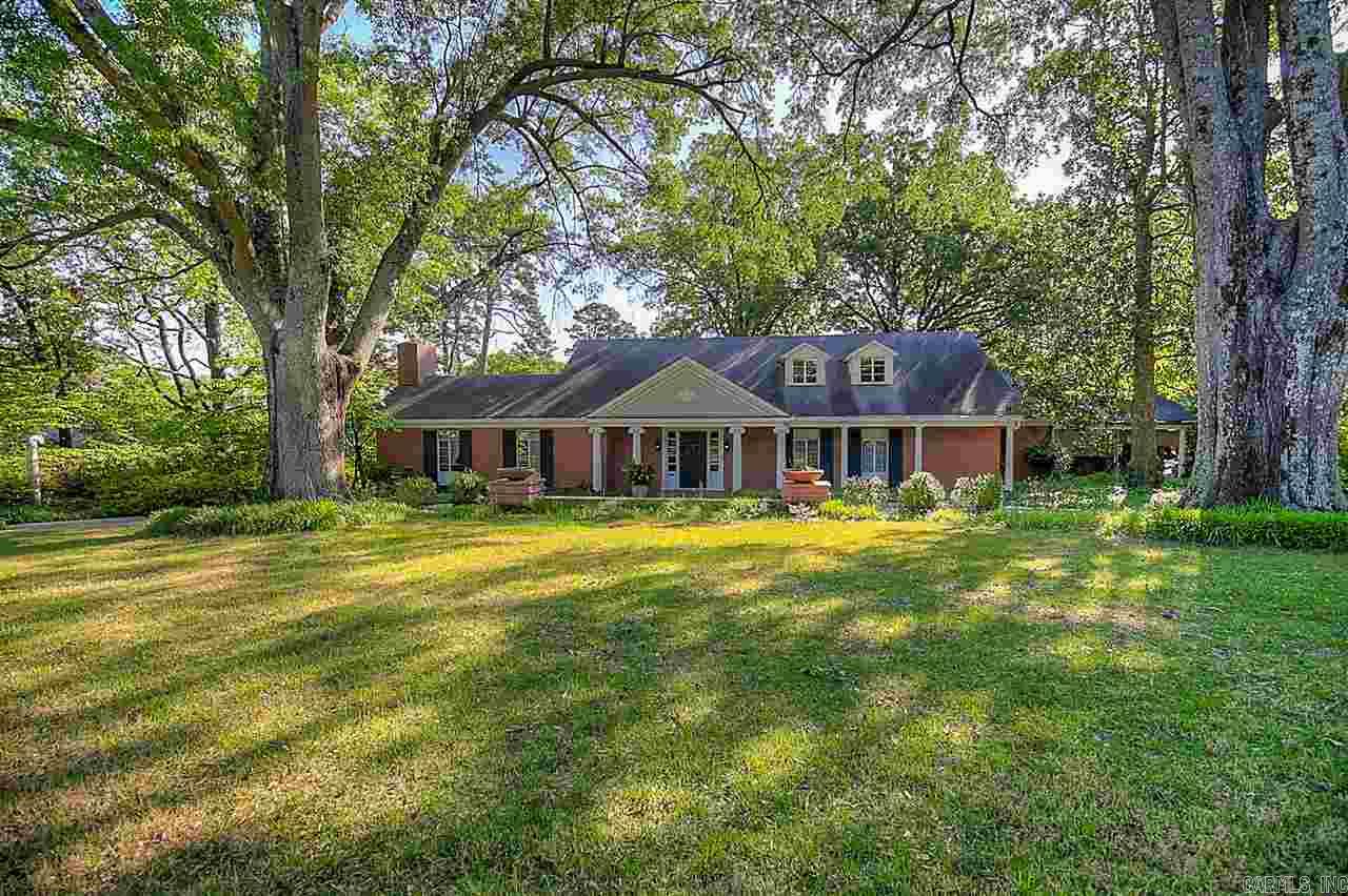 Stately home on 1.16 acre property. Circular drive, beautiful street, desirable neighborhood. 3 living areas - all rooms are exceptionally large & open. Floor to ceiling windows afford views to landscaped yard, pool area, distant valley & hills. 9' ceilings , hardwoods throughout. 335 sf guest house (heated and cooled, not included in main house measurements). 2 car carport w/workshop - storage. Beautiful 18' x 36' pool. A very special property.