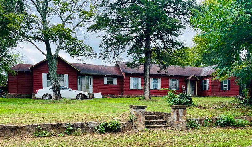 Dear investors, contractors, and handy men-here’s your ticket! Not one but FIVE houses up for grabs in this 4 acre parcel in the heart of Quitman. Within walking distance of shops and stores in town. And just 15 minutes from Greers ferry lake! The perfect destination for fisherman and water lovers (Air bnb?) The “main house” has traditional mid century architecture throughout (and is known as “the town’s piano teachers house” originally. So cute!!) the current owners have done a ton of updates but there’s still more left to made. However,  it’s 100% comfortably livable and ready for your own spin on this big, beautiful classic! But we can’t stop there. There’s a massive 2 story barn, 2 storm shelters, a well, 4 acres of land, and the 4 bonus houses. They do need a good bit of work (previous owner was hoarder and it’s been one bite a time to repair) or perhaps taken down, but you’re still left with city water/sewer/electric capabilities on 4 of them and septic/electric on the back house. There is limitless potential to this place!!!