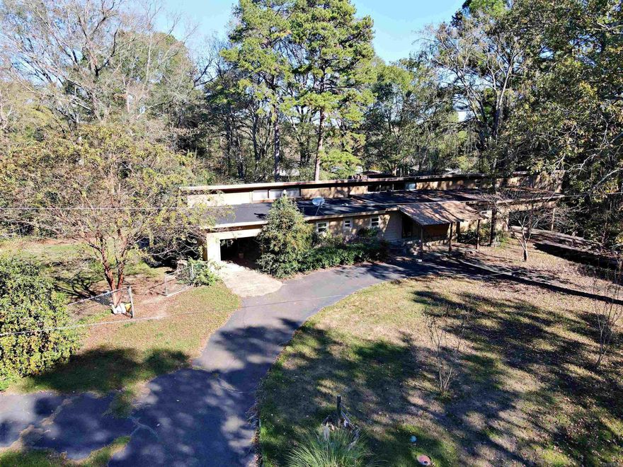 Come take a look at this Gem. 5 minutes or less from DeGray Lake and the Golf Course. Original Structure of a Modular Home with Structurally Sound Construction surrounding. Large living space with a fabulous Vaulted Ceiling in the added on Sun Room. Has a 3 car garage with a couple of great work spaces/storage space. Chain link fenced in backyard just waiting for you. Asphalt Circle Drive. Roof replaced in 2023, HVAC in 2021. Presented "AS IS".