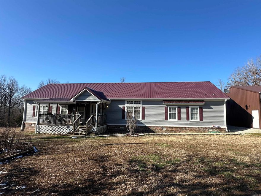 This stunning Custom Manufactured three-bedroom, two-bathroom home on 13 +/- private acres is filled with custom-built features and newly remodeled upgrades throughout. Inside, you'll find a spacious living room, a separate dining room, and an eat-in kitchen with a large bar area, perfect for casual dining or entertaining. The large laundry room with an attached pantry provides ample storage and convenience.  A standout feature of this home is the expansive primary bedroom, which includes a built-in office space, making it ideal for working from home or creating a private retreat. The primary suite offers a luxurious soaking tub, a walk-in shower, and a huge walk-in closet, along with enough space for a cozy sitting area. Positioned on the opposite side of the home from the additional bedrooms, the primary suite ensures privacy.  Throughout the home, you'll find custom built-ins that enhance both style and functionality. The home has undergone several recent updates, with modern touches that make it truly move-in ready. One of the biggest highlights is the brand-new pool and deck, just added to create the perfect outdoor oasis for entertaining or relaxing in complete privacy.