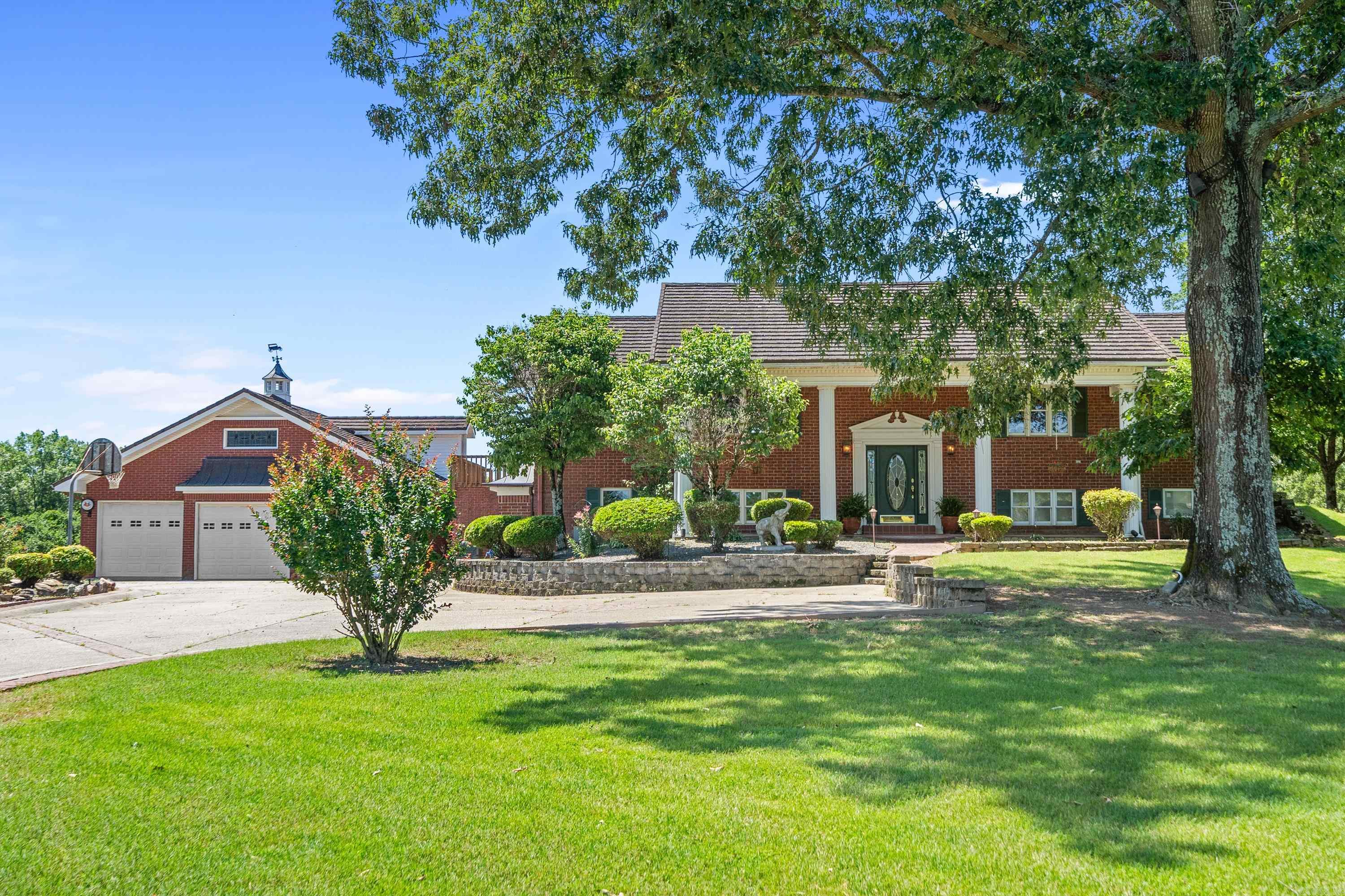 Motivated Seller! Nestled at the end of a secluded road, discover the ultimate retreat on this sprawling 22.91-acre mini farm. The main residence, spanning 3538 sq. ft., presents a primary suite on the main level, complemented by a 2-car attached garage with ample built-ins. Adjacent to the serene pool, a 3-car attached garage adorns the pool house, and 2-car attached at the in-law quarters with 3 more garage doors being used as a shop providing practicality. Immerse yourself in the tranquil mountain vistas that envelop both the pool and the home. As you pass through the gated entrance, an inviting sight unfolds – a detached barn/building boasting multiple bays and in-law quarters, accompanied by an additional barn nestled at the rear. Inside, the ambiance is enriched by vaulted ceilings and the warmth of a wood-burning fireplace insert. The kitchen has double ovens, oak cabinets, and a vaulted wood ceiling in the dining room & primary bedroom. Downstairs, has a bedroom/bonus room offers lots of possibilities, with a floored attic storage above the pool house. Entertainment beckons with a pool house, while outdoor enthusiasts will love the presence of an outdoor kitchen.