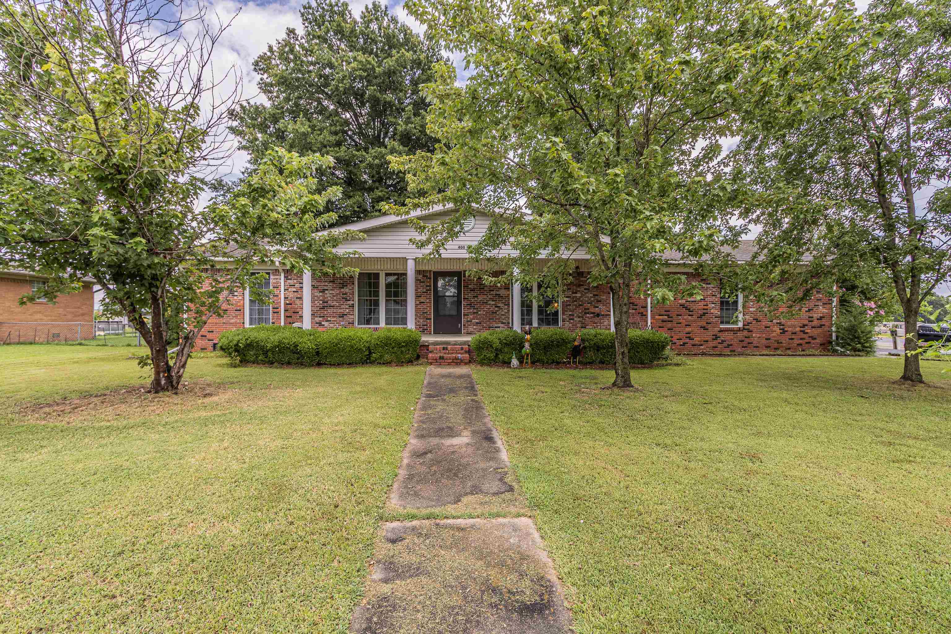 Solid brick 3BR/2.5BA home on spacious corner lot with endless potential! Easily convert to 4 bedrooms. Features include fenced yard, gas fireplace, attached garage + detached garage w/ bathroom (perfect for apartment conversion), and storm shelter for up to 10 people. Gas & electric utilities. Crawl-space foundation w/solid floors. Roof has <10 yrs life remaining —$7,5000 allowance offered at closing can be applied to shingles or closing cost. Don’t miss this value-packed opportunity! 400 N 1st St. - Marmaduke 3/2.5 2006 sqft +/- brick home on corner fenced 142x114 lot (.37+/-). Less than 1 mile from highschool. $149,900 ($74.00 a sqft before concessions) property is assessed $176,000 CMA suggest house to be worth $200k+/- !!