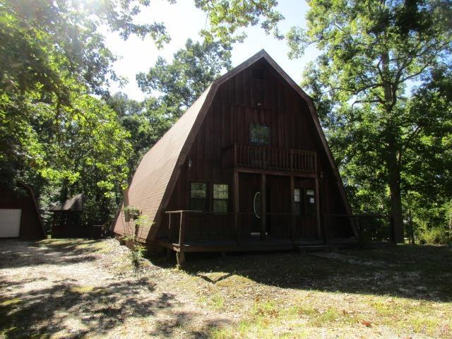 Country living at its best. This A frame home is located in Grant County and sits on 2.5 acres. Primary bedroom and bath are downstairs. There is also a half bath downstairs. Living room has big, exposed beams. Two bedrooms upstairs have a jack-n-jill bathroom. Back deck on home to sit and enjoy coffee or your favorite beverage. Gazebo in backyard. Detached garage. **Agents See Remarks**
