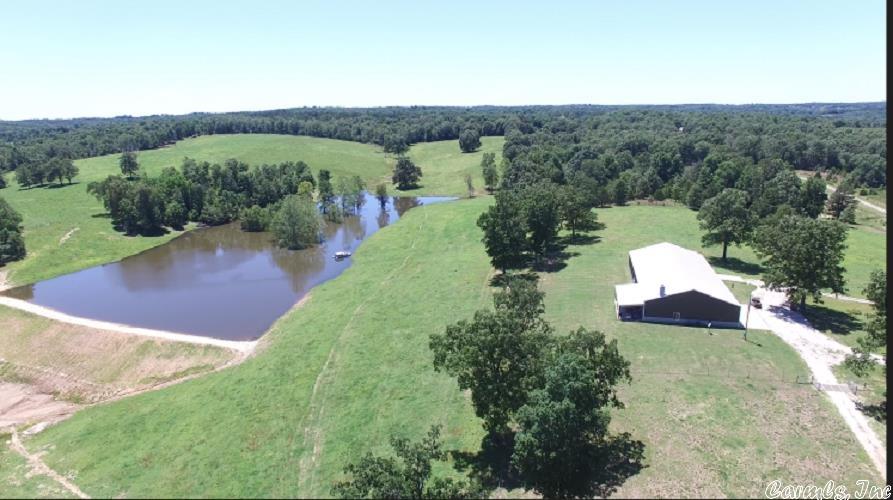 This immaculate cattle farm comes with 278 acres of improved pasture with cross fencing, live creek, and other water sources. County road frontage across front and back sides. Cattle guards, metal gates, concrete creek crossing, bull panel corral and holding pens. 5 acre private lake. Home is virtually hand crafted, custom cabinetry, wide hallways open to living space dominated by massive stone fireplace, master suit is a 17x21 lady's paradise, and much more! No other home like this one! Call for a showing