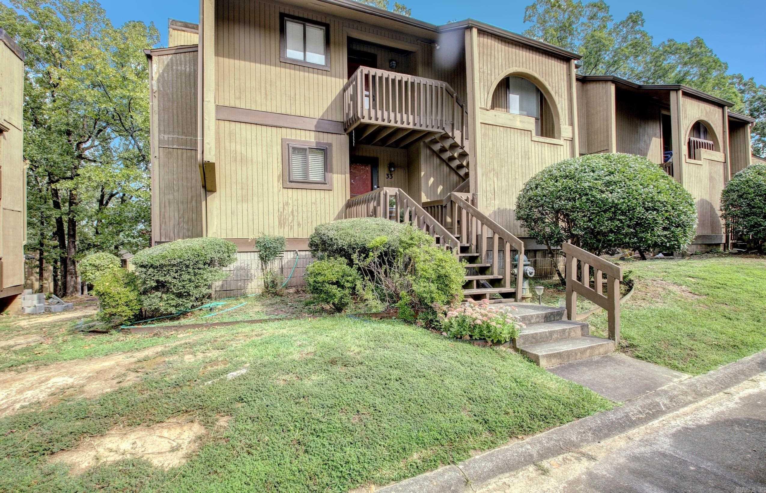 Don’t miss this beautifully updated second-floor condo near the pool! Featuring fresh paint, modern light fixtures, and Shaw luxury vinyl flooring throughout, this home offers a perfect blend of style and comfort. Both the kitchen and bathrooms have been completely renovated. The living room boasts a cozy fireplace and sliding glass doors that open to a covered patio. A second covered patio provides additional outdoor storage. Conveniently located near shopping, restaurants, and the interstate, this condo is a must-see!